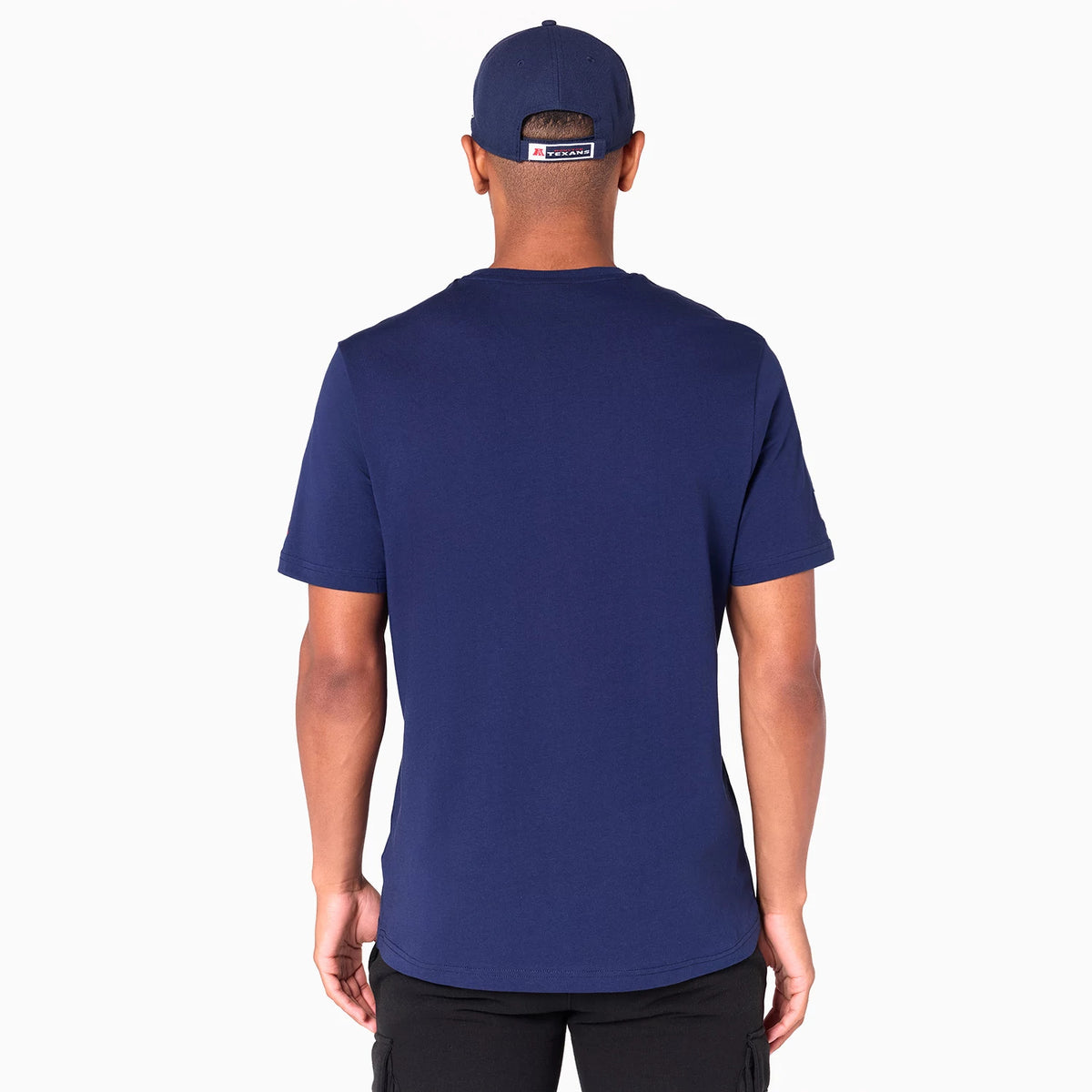 New Era Houston Texans NFL Navy T-Shirt, rear view showing a plain navy back with short sleeves and a small raised logo on the navy cap worn by the model, creating a cohesive look between the shirt and headwear.