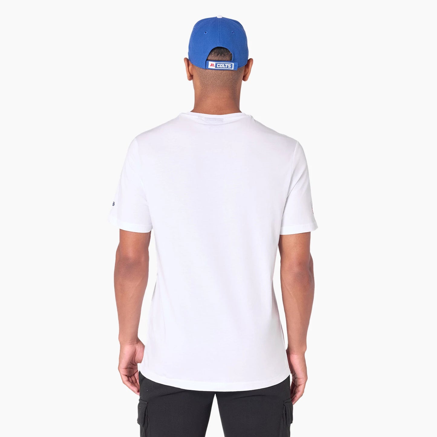 New Era Indianapolis Colts NFL White T-Shirt, rear view showing a plain white back panel with short sleeves, an embroidered New Era logo on the left sleeve, and a blue cap featuring a raised logo at the back above the neck.