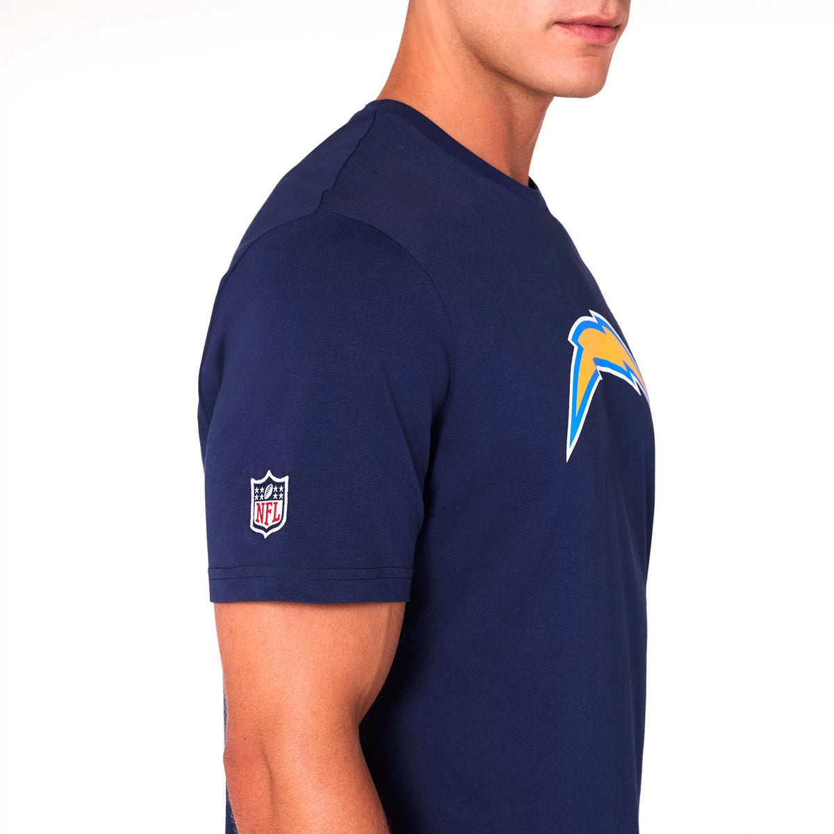 New Era LA Chargers NFL Blue T-Shirt, side view showing the bright blue NFL Chargers logo on the chest, an NFL shield patch embroidered on the sleeve, and the clean lines of the short sleeves and round neck design.
