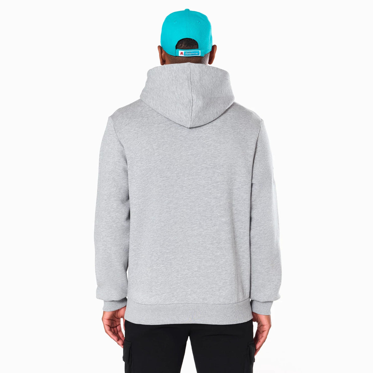 New Era Miami Dolphins NFL Grey Pullover Hoodie, rear view showing the back of the grey hoodie with its hood up, worn by a model in black trousers and a turquoise cap with an embossed logo on the back.