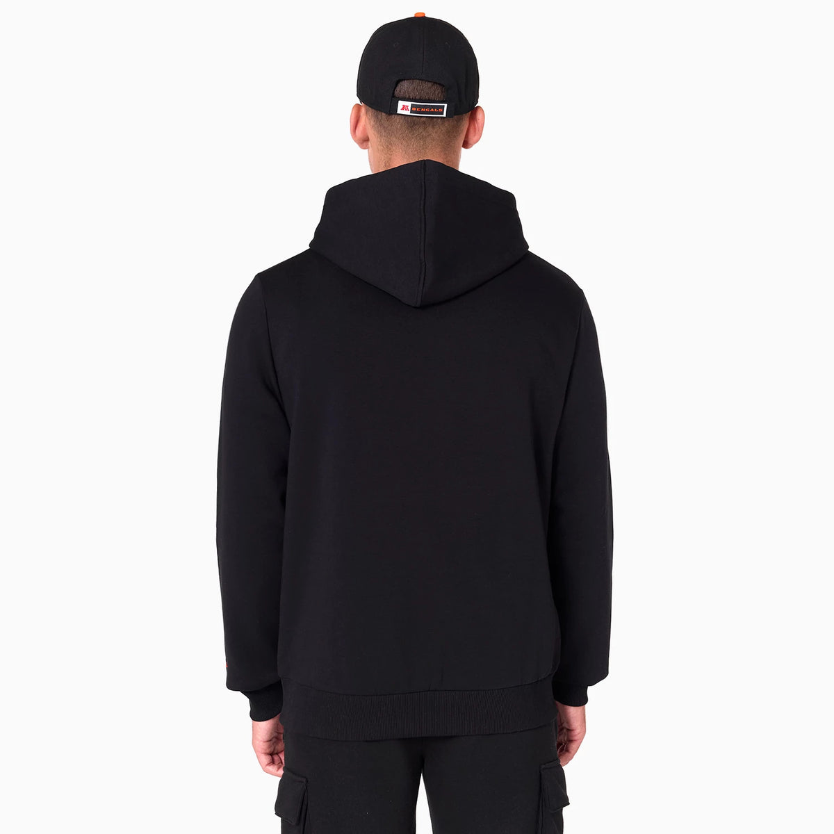 New Era Cincinnati Bengals NFL Black Pullover Hoodie, rear view showing the plain black back with an attached hood, worn by a model wearing a black cap with a raised NFL logo centred on the back panel.
