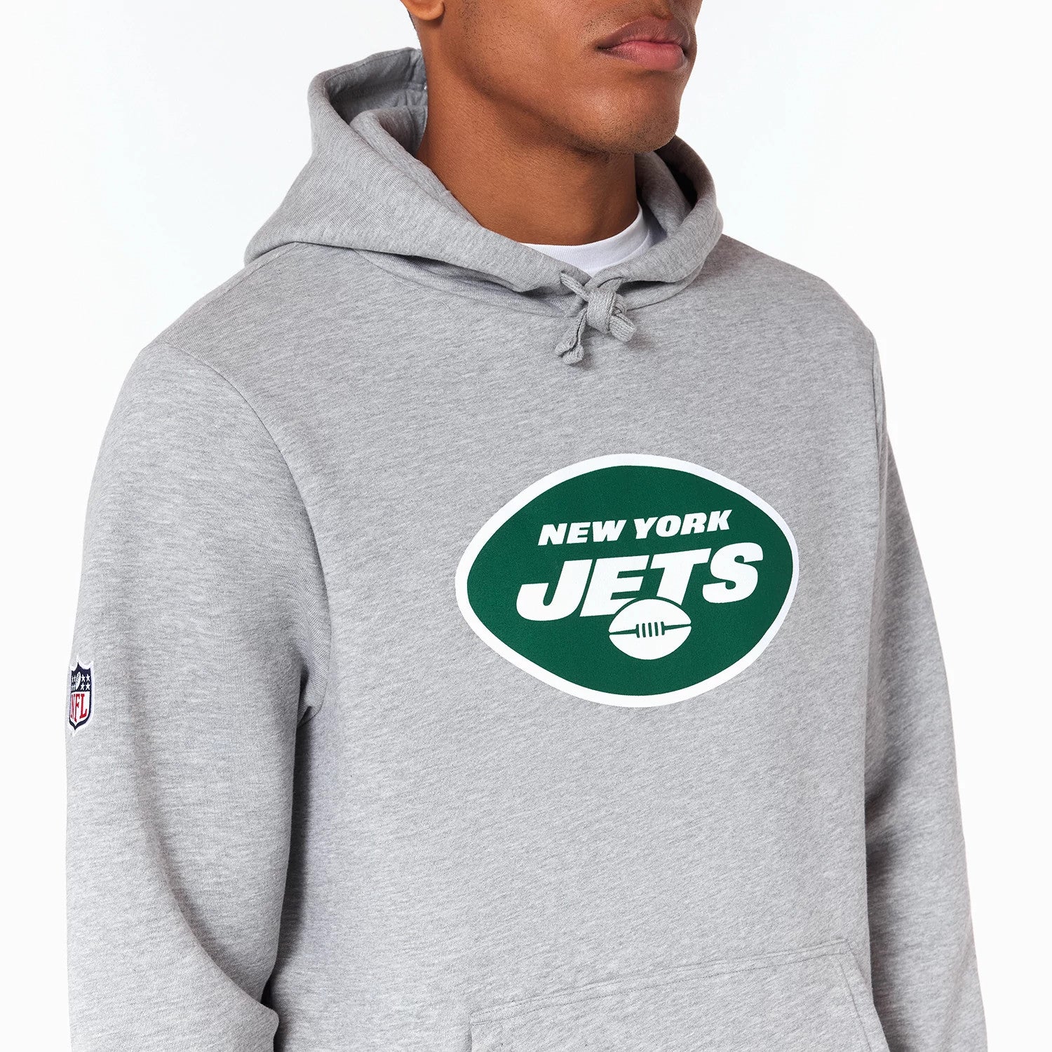 New Era New York Jets NFL Grey Pullover Hoodie, front view showing the green and white New York Jets logo printed centrally on the chest, a drawstring hood and an embroidered NFL logo patch on the left sleeve.
