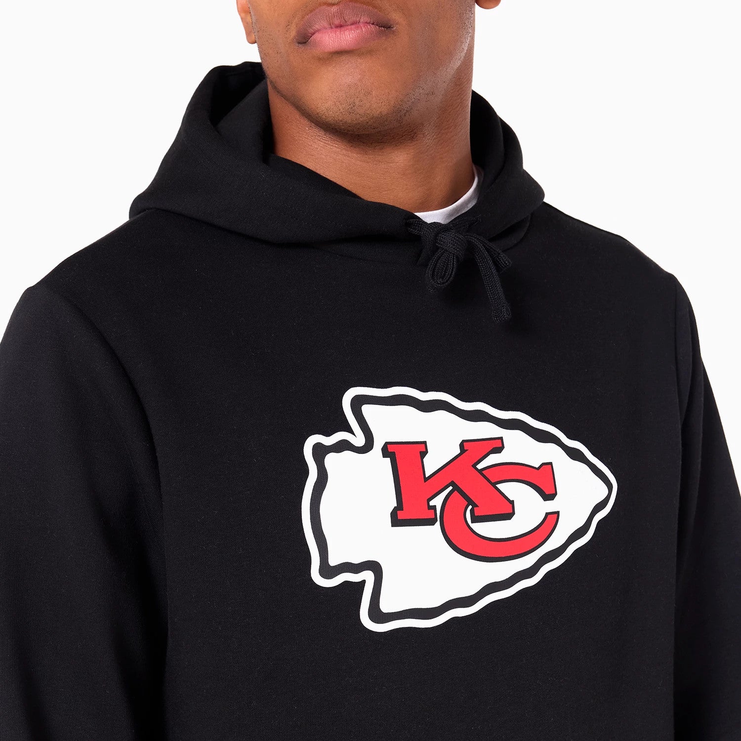 New Era Kansas City Chiefs NFL Black Pullover Hoodie, front view showing a large red and white Kansas City Chiefs logo centred on the chest, a drawstring hood above and long sleeves extending to the wrists.