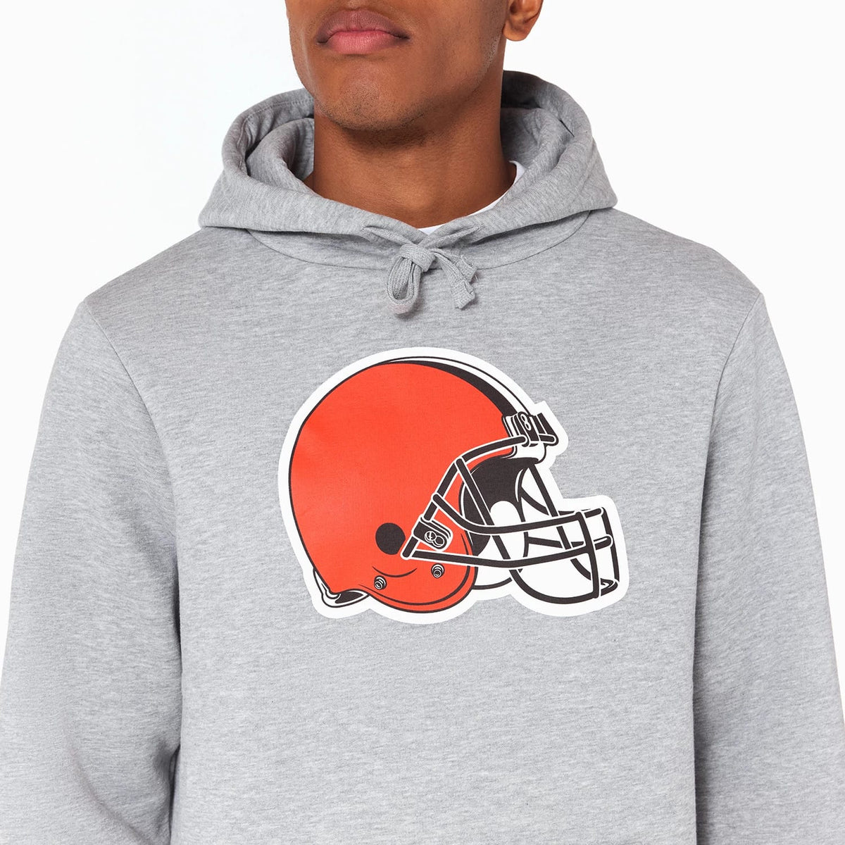 New Era Cleveland Browns NFL Grey Pullover Hoodie, front view showing a large helmet graphic on the chest with drawstrings on the hood and a plain grey background featuring no additional branding.