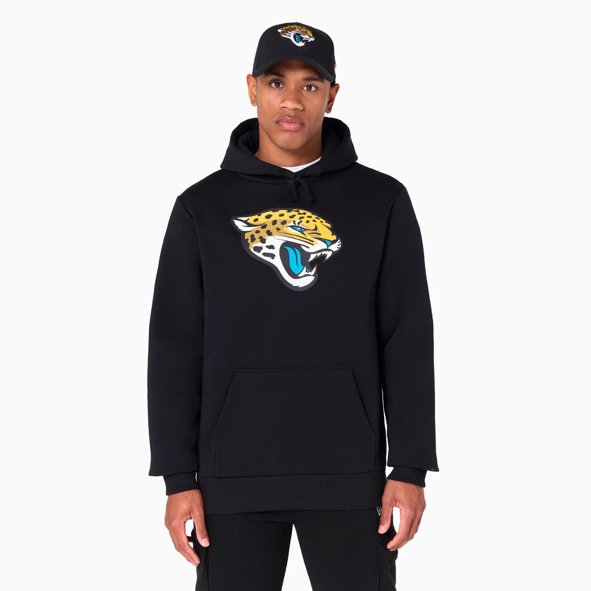 New Era Jacksonville Jaguars NFL Black Pullover Hoodie, on-model view showing the jaguar logo printed on the chest, paired with a black cap featuring the same jaguar logo on the front.