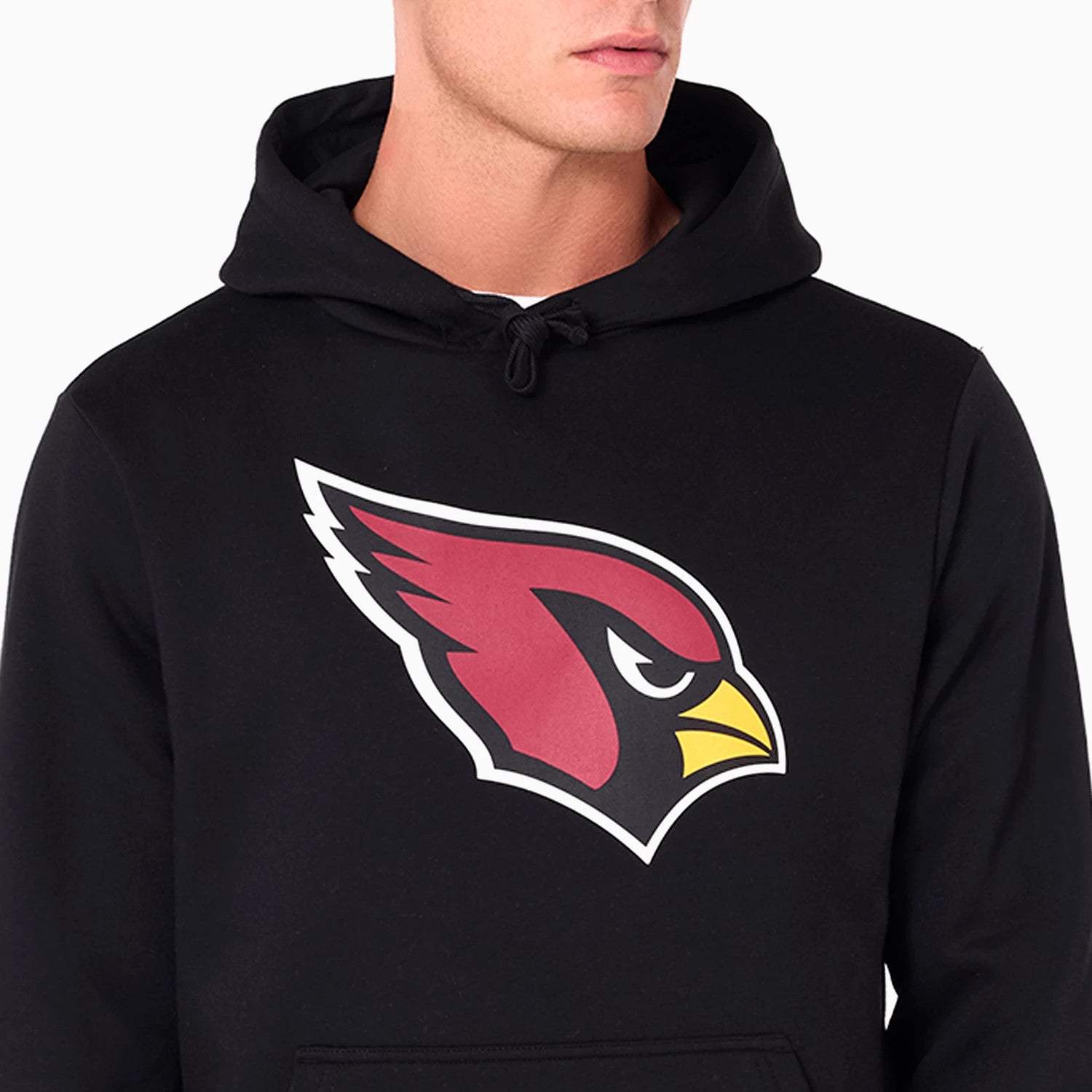 New Era Arizona Cardinals NFL Black Pullover Hoodie, front view showing the large printed red cardinal head logo with a yellow beak centred on the black fabric, the hood tied with black drawstrings above the chest.