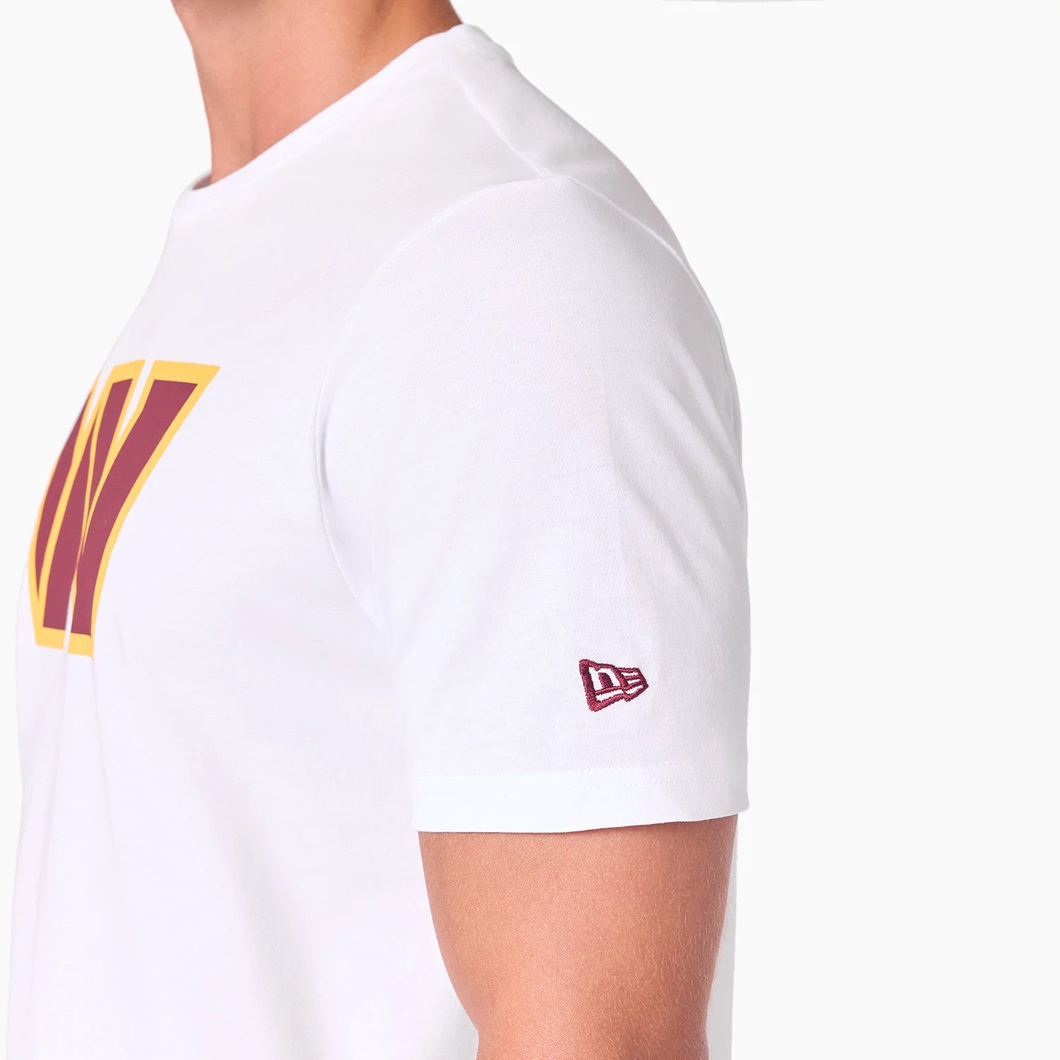 New Era Washington Commanders NFL White T-Shirt, side view showing the maroon and gold W logo on the chest with a raised New Era logo embroidered in maroon on the left sleeve against the plain white fabric.