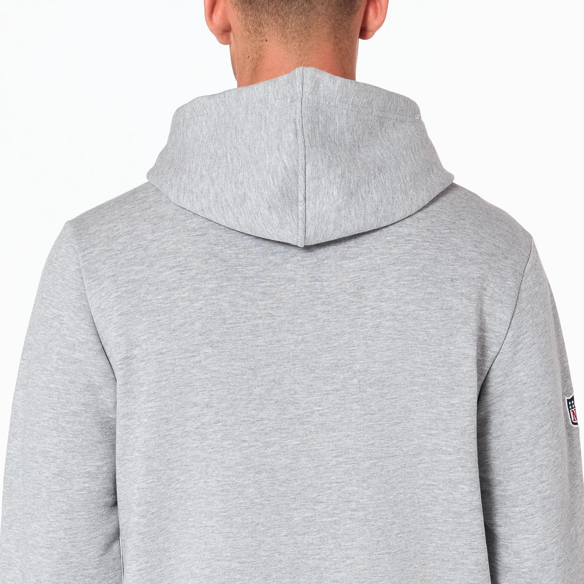 New Era LA Chargers NFL Grey Pullover Hoodie, rear view showing the light grey hood and upper back with an embroidered NFL logo on the left sleeve, the plain design highlighting the contour of the hoodie.