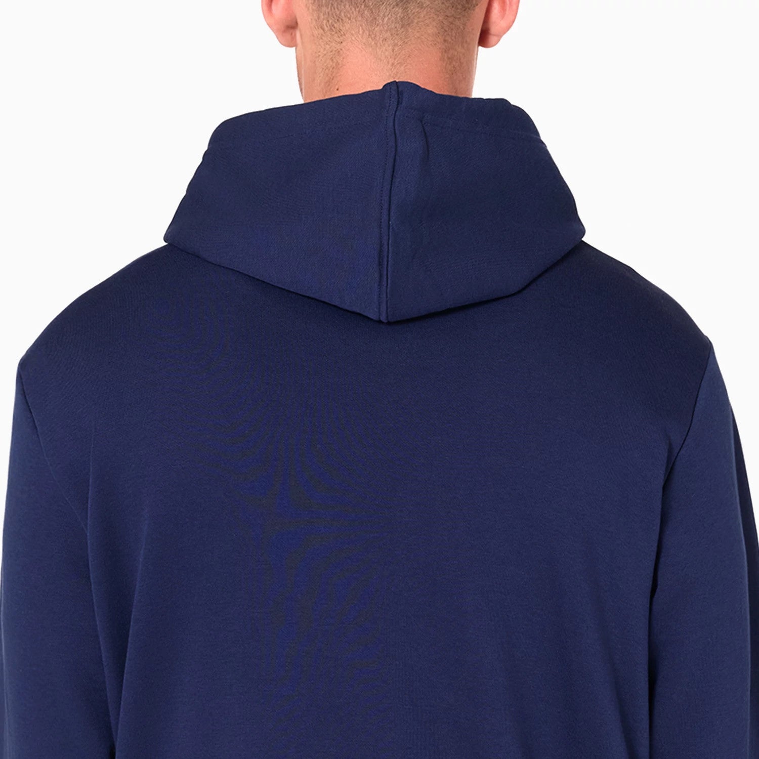 New Era Detroit Pistons NBA Navy Pullover Hoodie, rear view showing the plain navy fabric of the hoodie with a spacious hood draped over the back, no visible logos or design elements on the back panel.