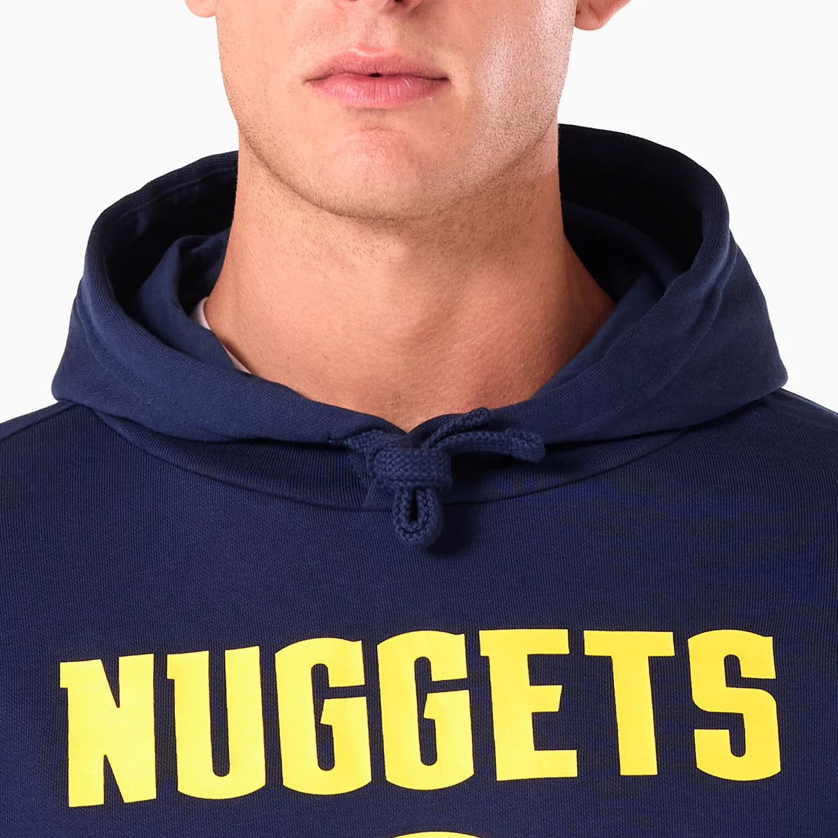 New Era Denver Nuggets NBA Navy Pullover Hoodie, front view showing the navy fabric with NUGGETS in large yellow letters across the chest, featuring an adjustable drawstring hood at the neckline.