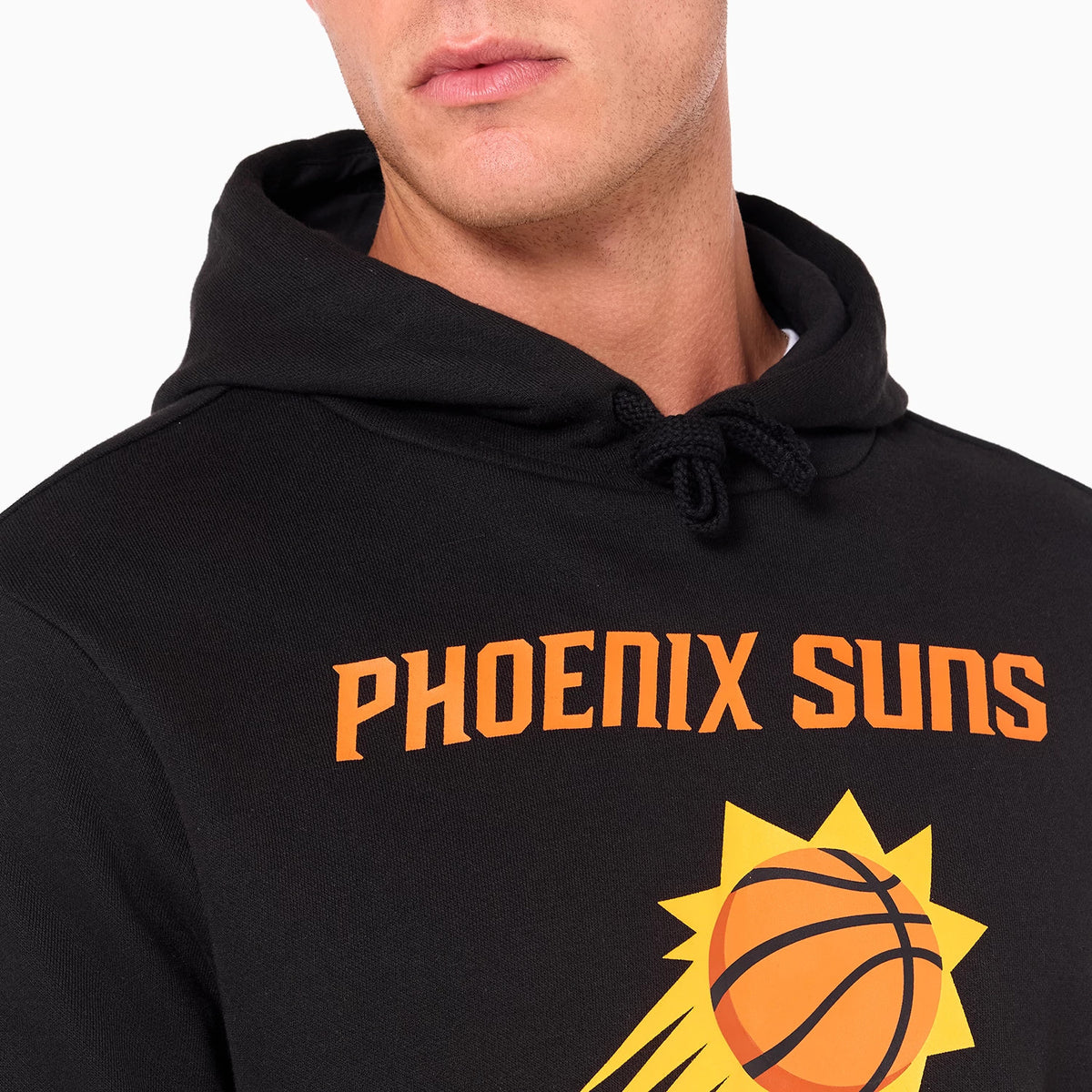 New Era Phoenix Suns NBA Black Pullover Hoodie, front view showing the bold orange Phoenix Suns text across the chest above a large orange and yellow basketball graphic, with black drawstrings hanging from the hood.