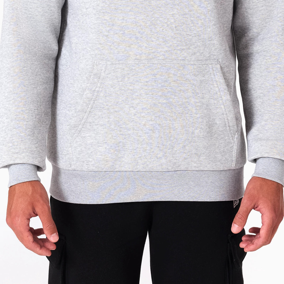 New Era Sacramento Kings NBA Grey Pullover Hoodie, front view showing the grey fabric with a large front pocket, ribbed cuffs and hem, and a small embroidered New Era logo at the bottom on the right side.