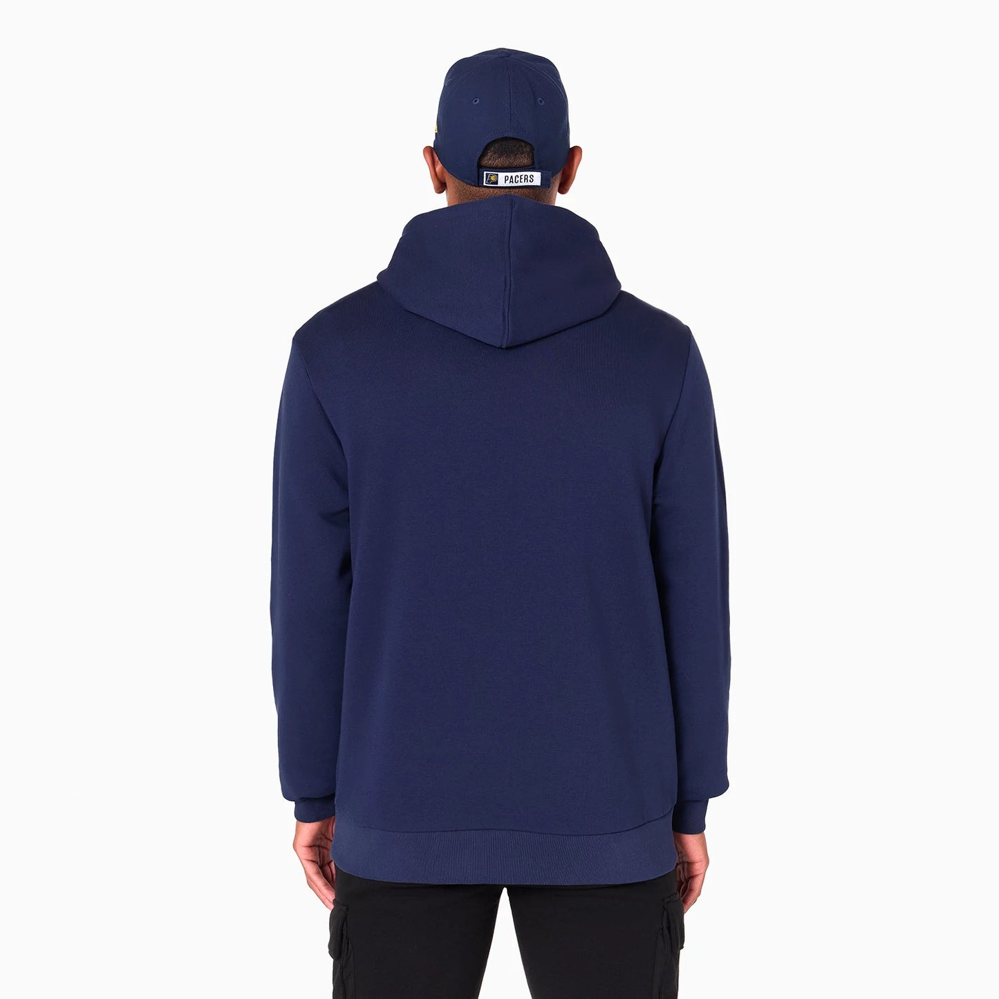 New Era Indiana Pacers NBA Navy Pullover Hoodie, rear view showing the solid navy fabric of the hoodie with a loose fit and the hood resting flat against the back, paired with a navy cap featuring an embroidered Pacers logo above the closure.