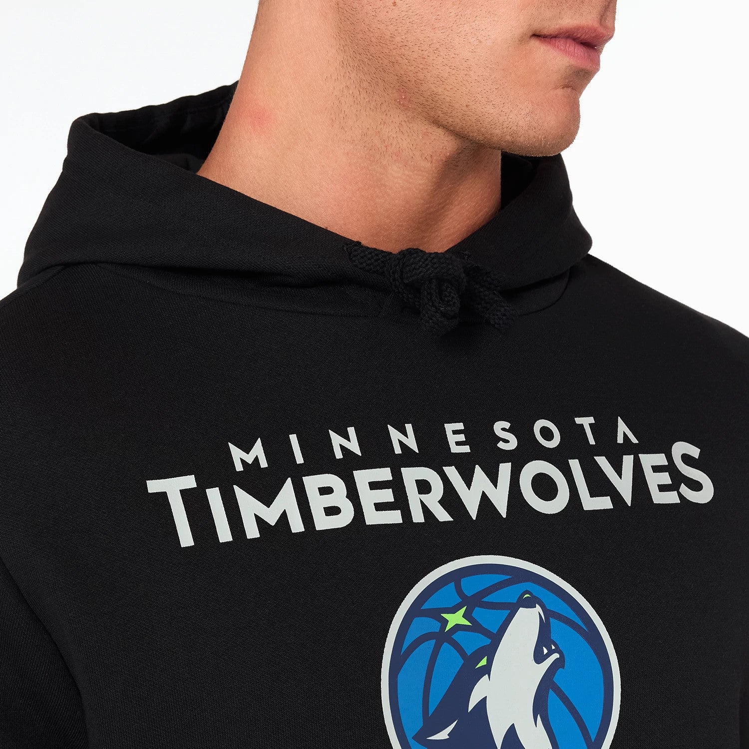 New Era Minnesota Timberwolves NBA Black Pullover Hoodie, front view showing the black fabric with a large printed Timberwolves logo centred on the chest, white MINNESOTA TIMBERWOLVES text above the logo, and a drawstring hood.