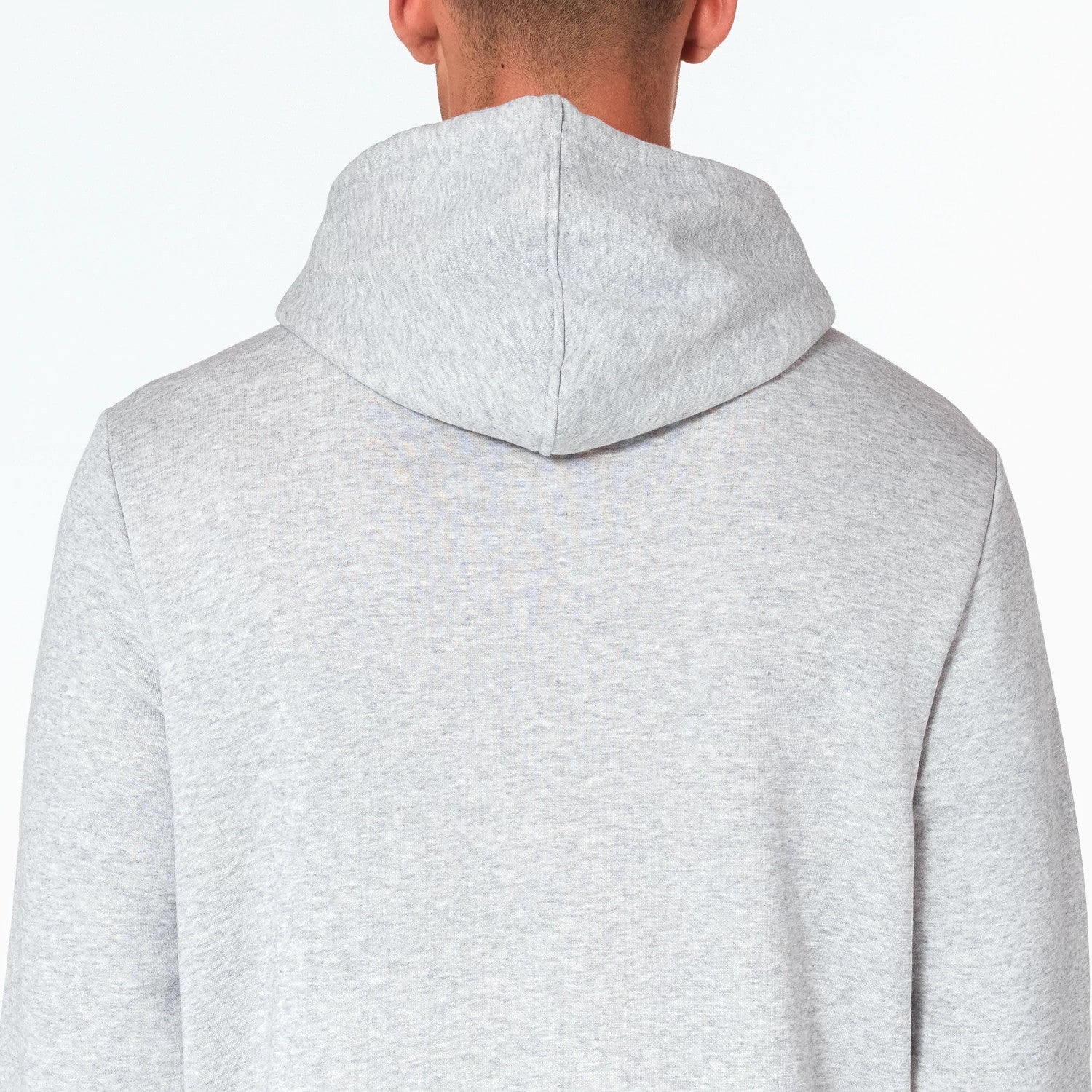 New Era Milwaukee Bucks NBA Grey Pullover Hoodie, rear view showing the back of the light grey hood, the seam running down the centre of the hood and the smooth fabric extending over the shoulders.
