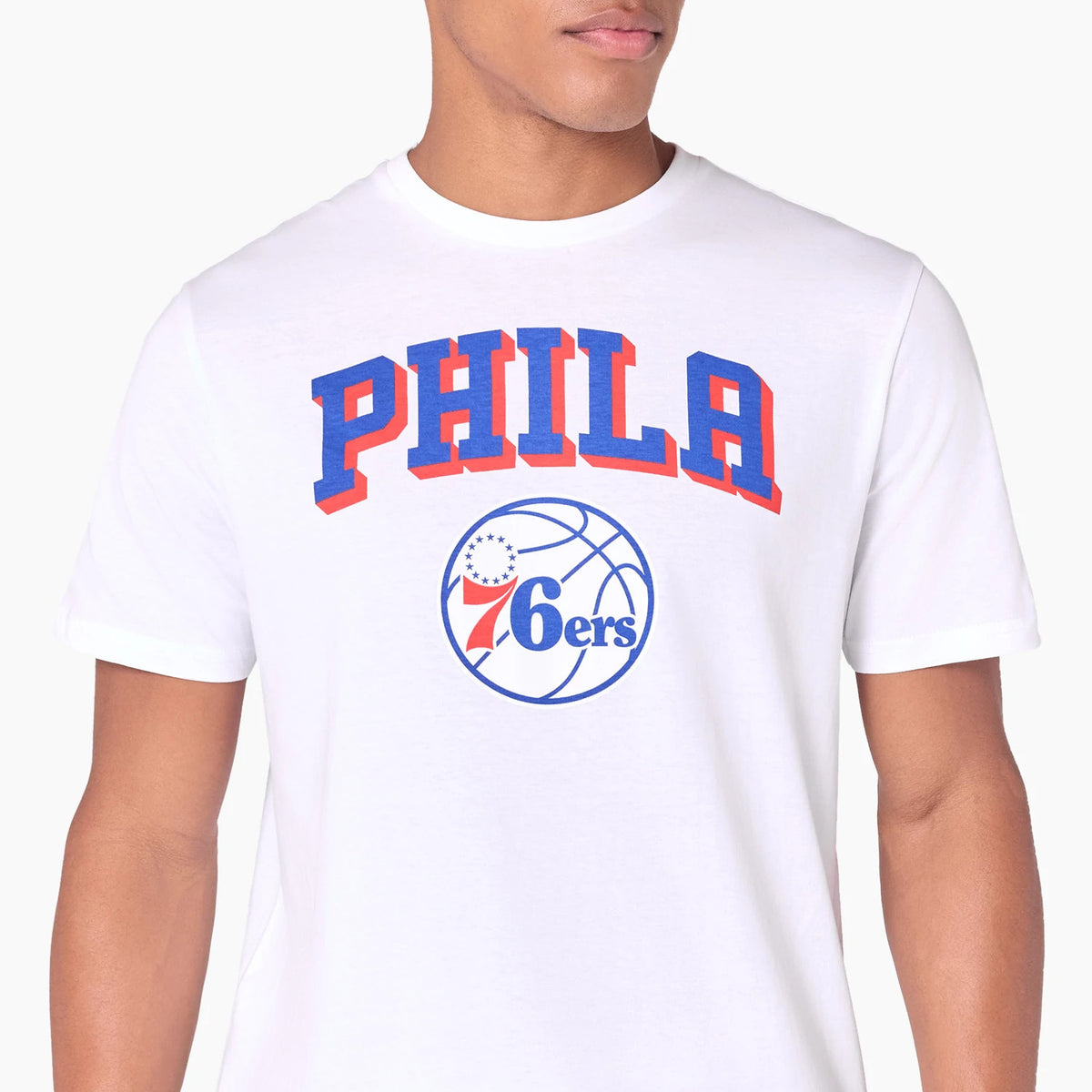 New Era Philadelphia 76ers NBA White T-Shirt, front view showing the word PHILA in bold blue and red letters above a blue basketball graphic with 76ers printed in red and blue on the chest.