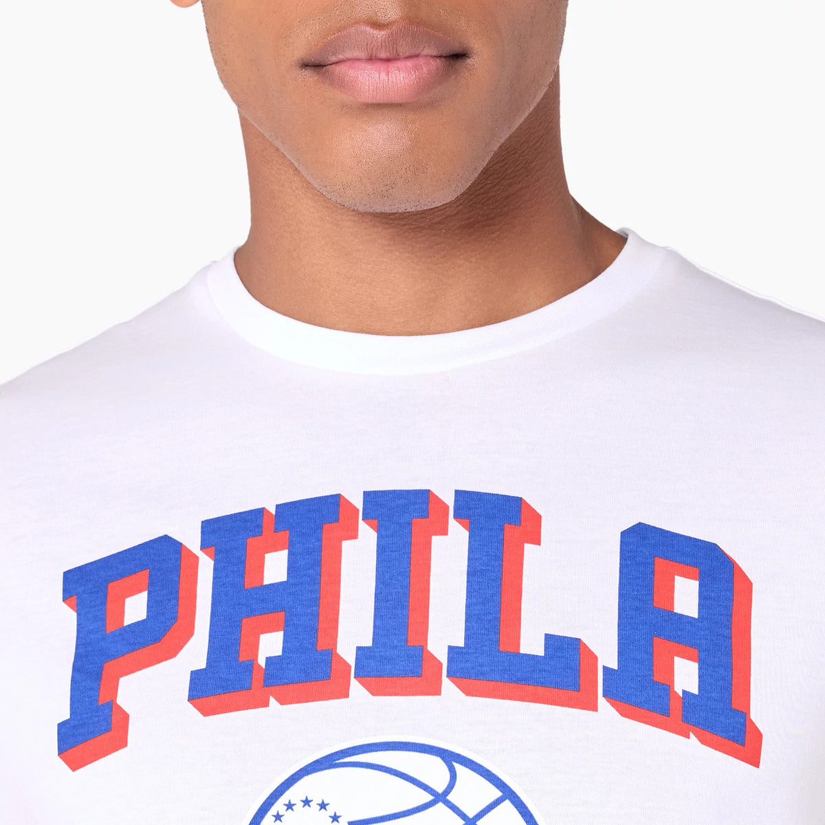 New Era Philadelphia 76ers NBA White T-Shirt, front view featuring PHILA in large blue and red letters across the chest, with a basketball logo printed below on a plain white fabric.