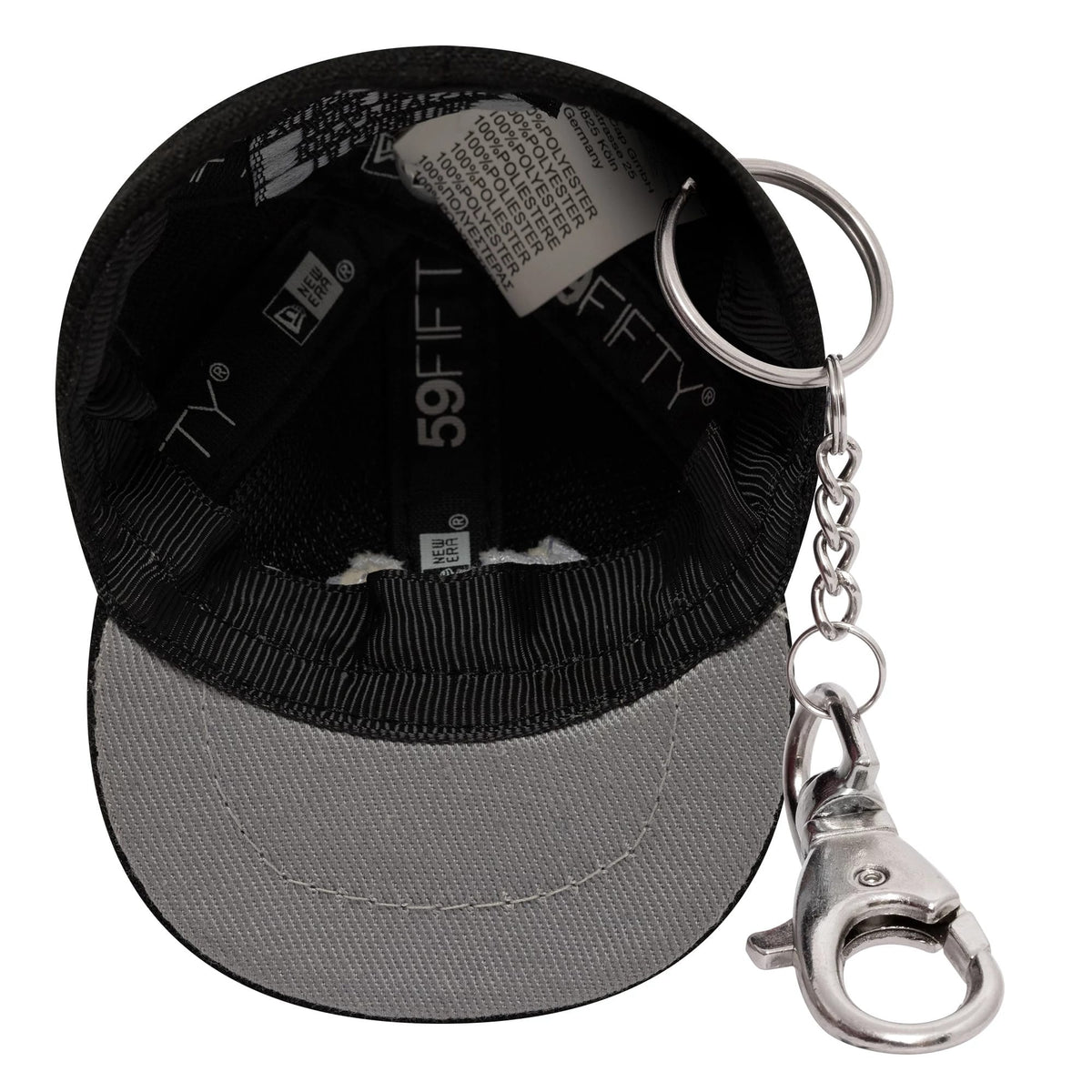 New Era New Era Mini Cap Black Key Chain, inside view showing black taping with 59FIFTY branding, a silver key chain attached to a grey visor, and a care label with fabric details beneath the crown.