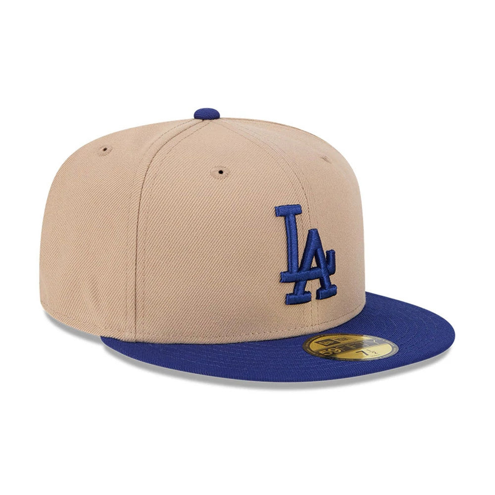 LA Dodgers MLB Evergreen Light Beige New Era 59FIFTY Fitted Cap, three-quarter view showing the raised blue LA logo on the front panel, contrasted with a blue visor and a gold 59FIFTY size sticker on top.