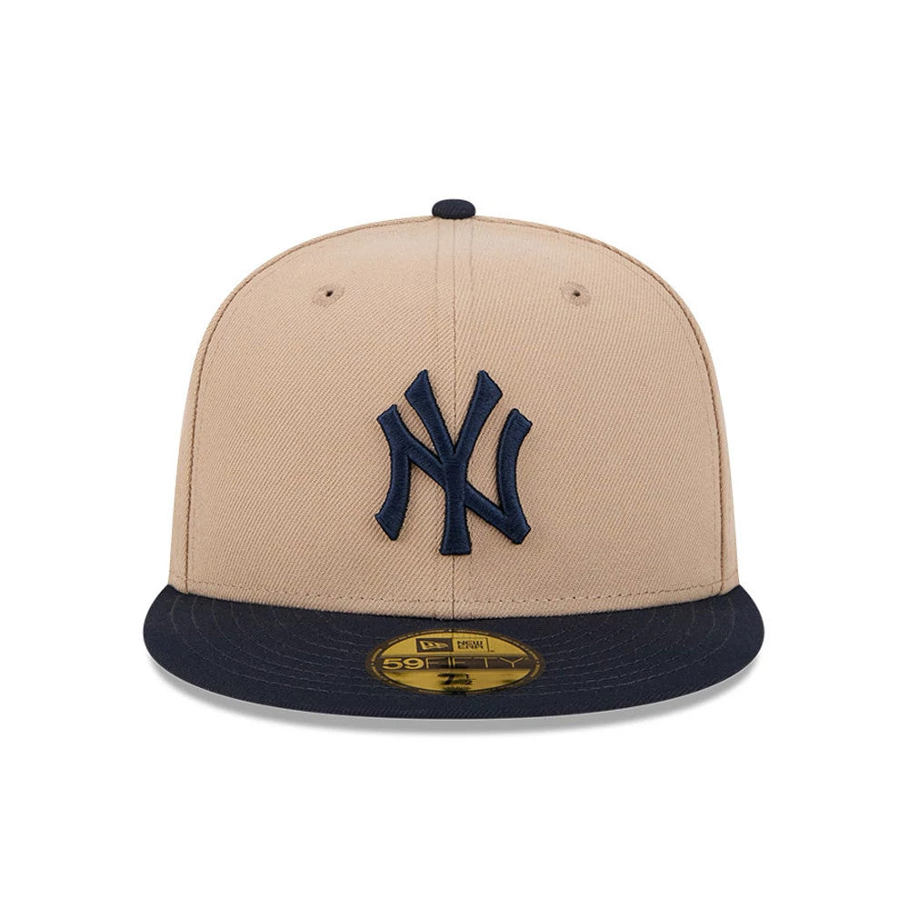 New York Yankees MLB Evergreen Light Beige New Era 59FIFTY Fitted Cap, front view showing a raised navy NY logo on the front panel, with a contrasting navy visor and the gold 59FIFTY size sticker on top of the visor.