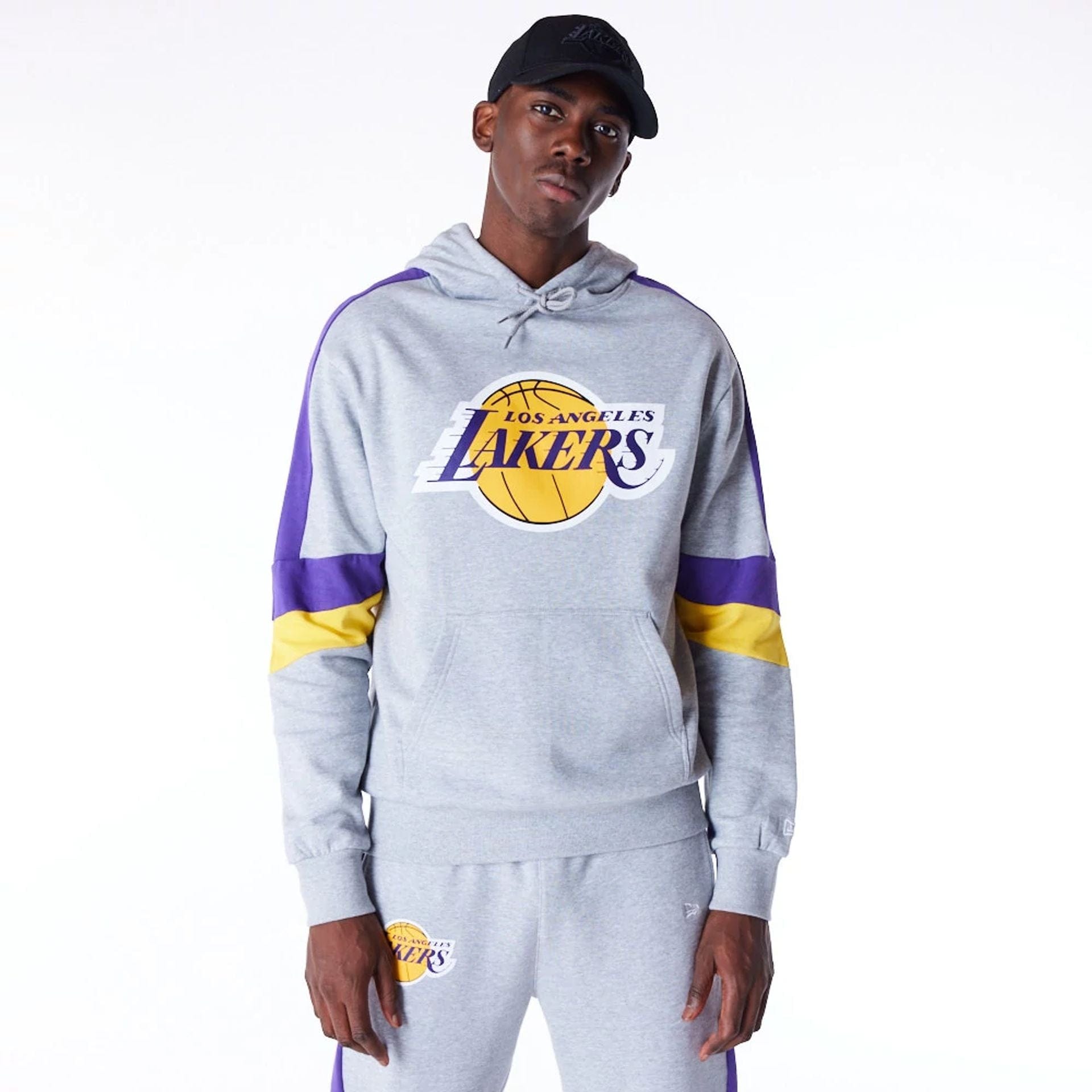 The Male model is wearing LA Lakers Colour Block Grey Pullover Hoodie 1