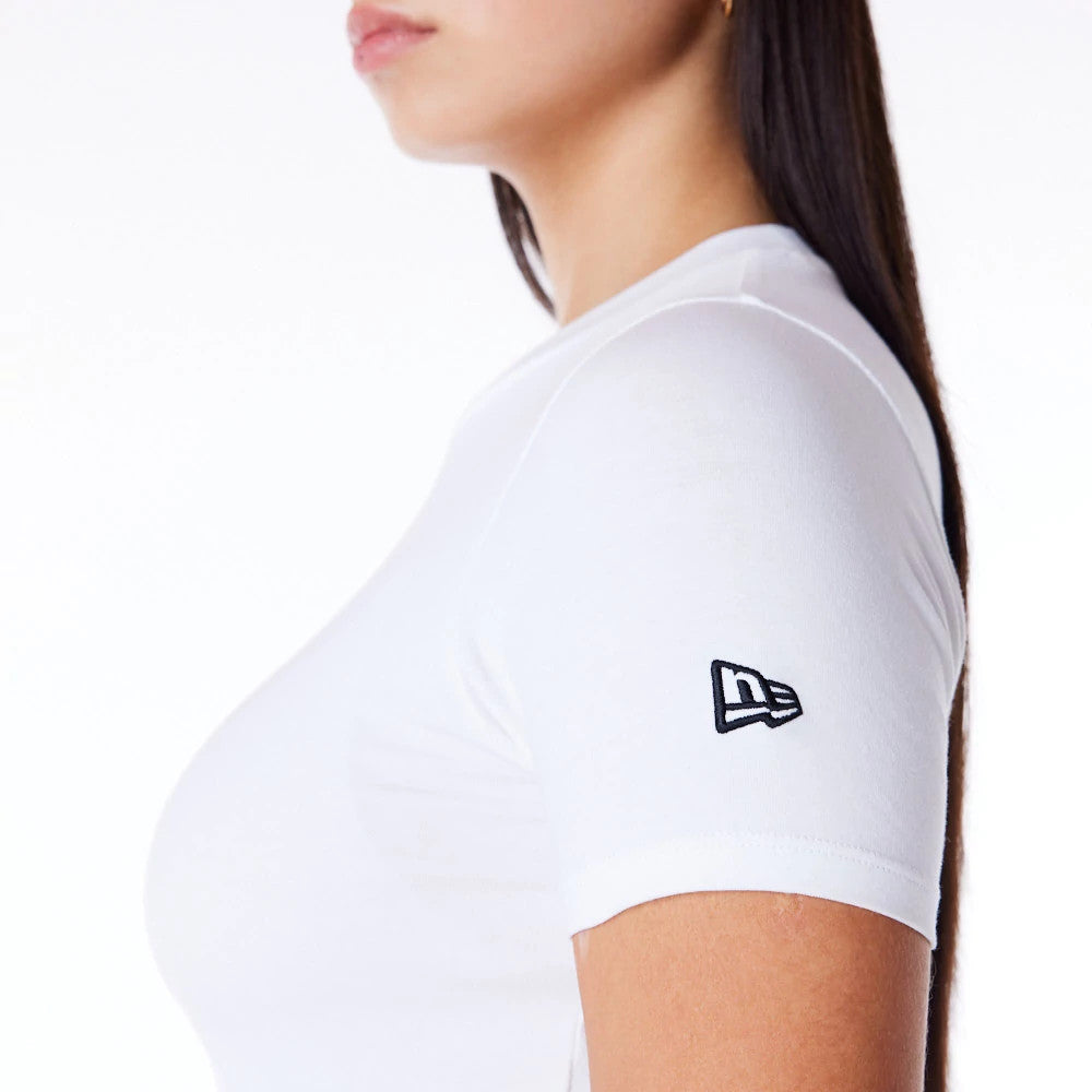 New Era Womens White Slim T-Shirt, side view showing the short sleeve design with a raised New Era logo in black embroidered on the upper arm, highlighting the fitted white silhouette against a plain background.