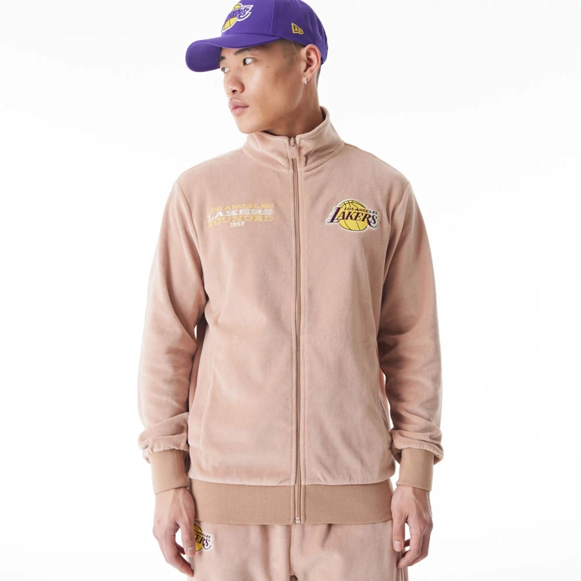 The Male model is wearing LA Lakers NBA Lifestyle Velour Beige Track Jacket 1