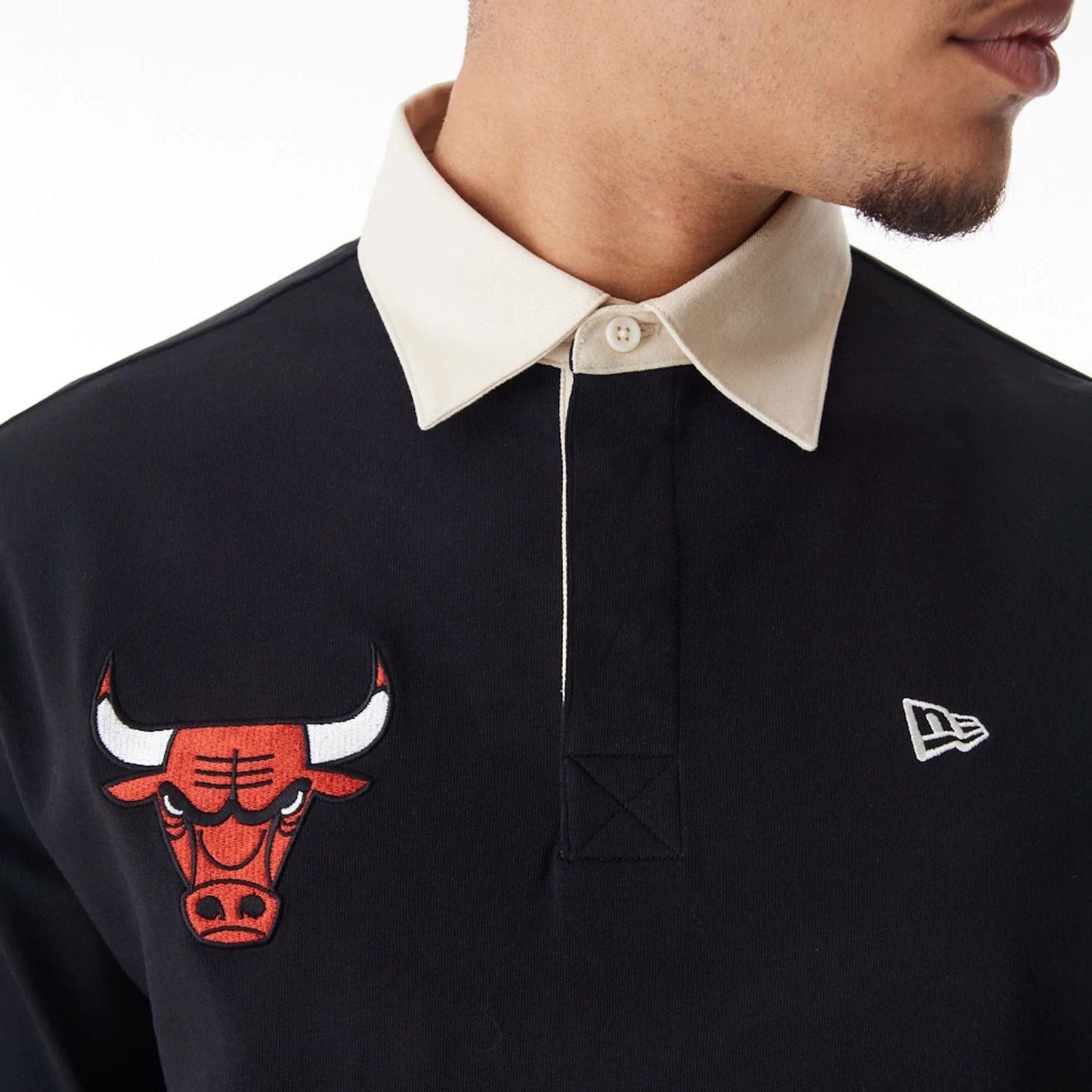The Male model is wearing Chicago Bulls NBA Lifestyle Black Rugby Shirt 5