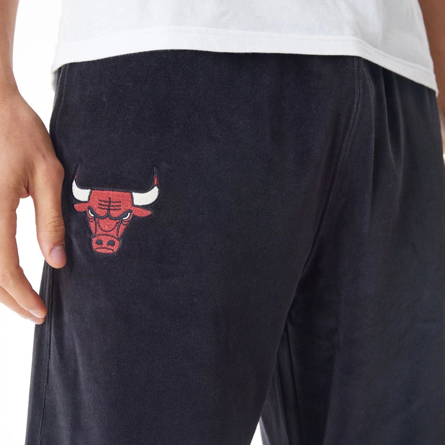 The Male model is wearing Chicago Bulls NBA Lifestyle Velour Black Track Joggers 9