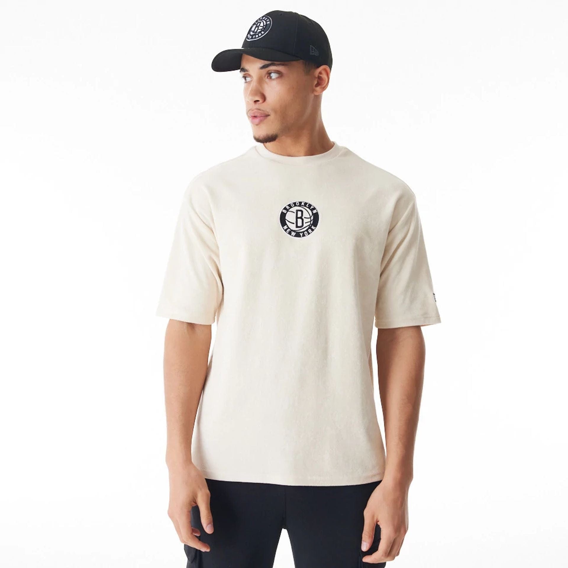 The Male model is wearing Brooklyn Nets NBA Lifestyle Velour Light Beige Oversized T-Shirt 1