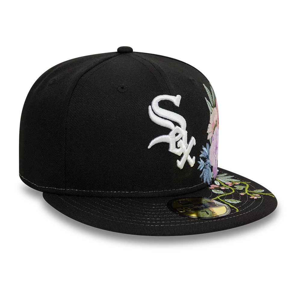 Chicago White Sox MLB Floral Black New Era 59FIFTY Fitted Cap, three-quarter view showing the raised white embroidered Sox logo on the front panel, floral embroidery on the visor, and the gold 59FIFTY size sticker on top.