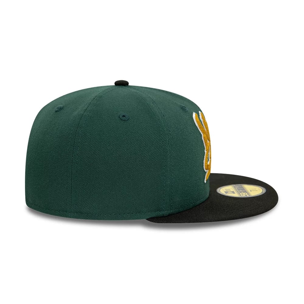 New Era Front Script Dark Green & Black New Era 59FIFTY Fitted Cap, side view showing the green structured crown with black top button and flat visor, featuring a gold embroidered design on the front panel and gold 59FIFTY size sticker.
