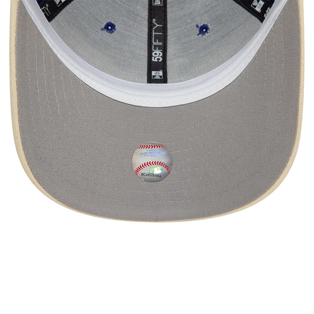 LA Dodgers MLB Team Wings Navy New Era 59FIFTY Fitted Cap, inside view showing grey undervisor with MLB holographic sticker, black taping with 59FIFTY branding, and contrasting white sweatband around the crown edge.