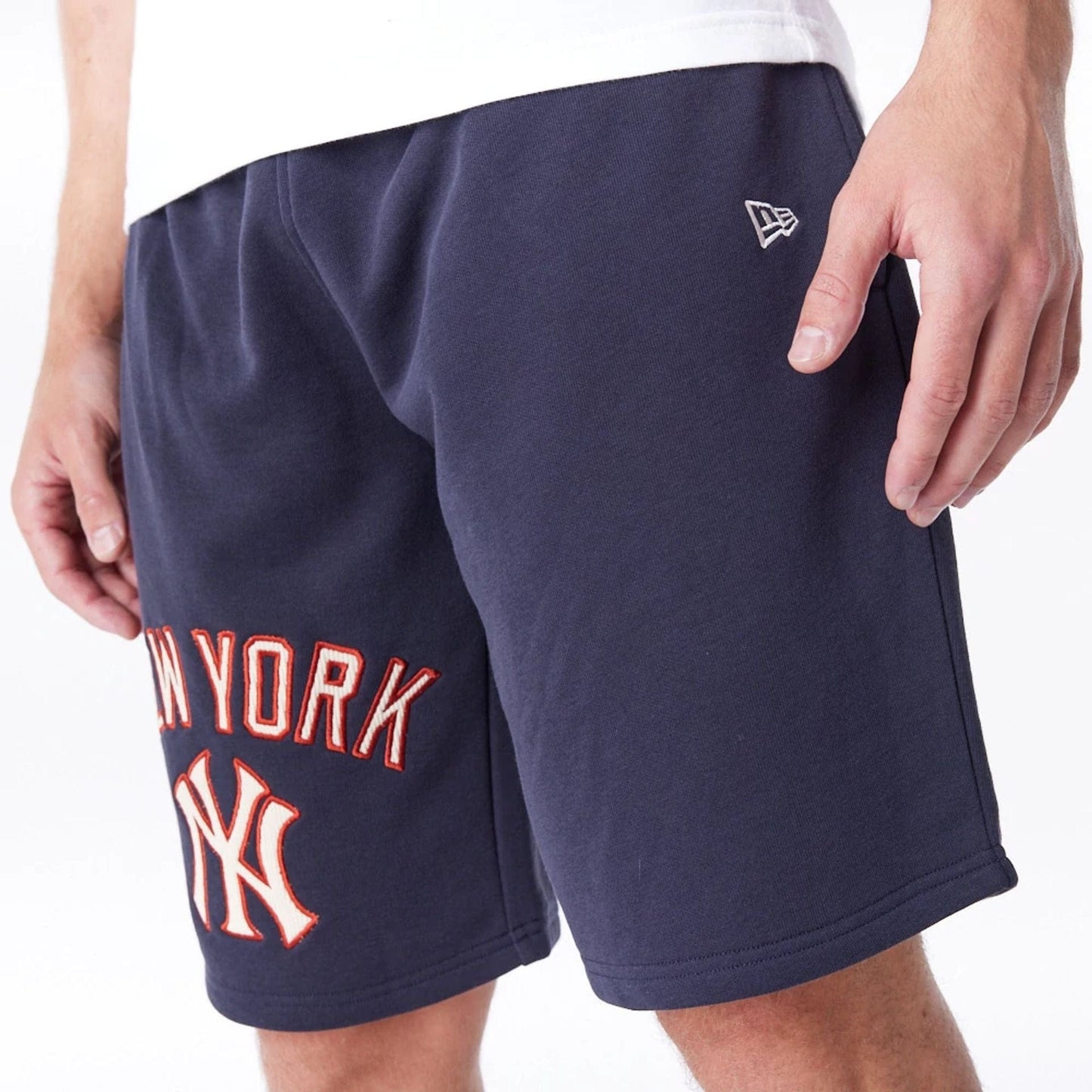 The Male model is wearing New York Yankees MLB Lifestyle Navy Shorts 8