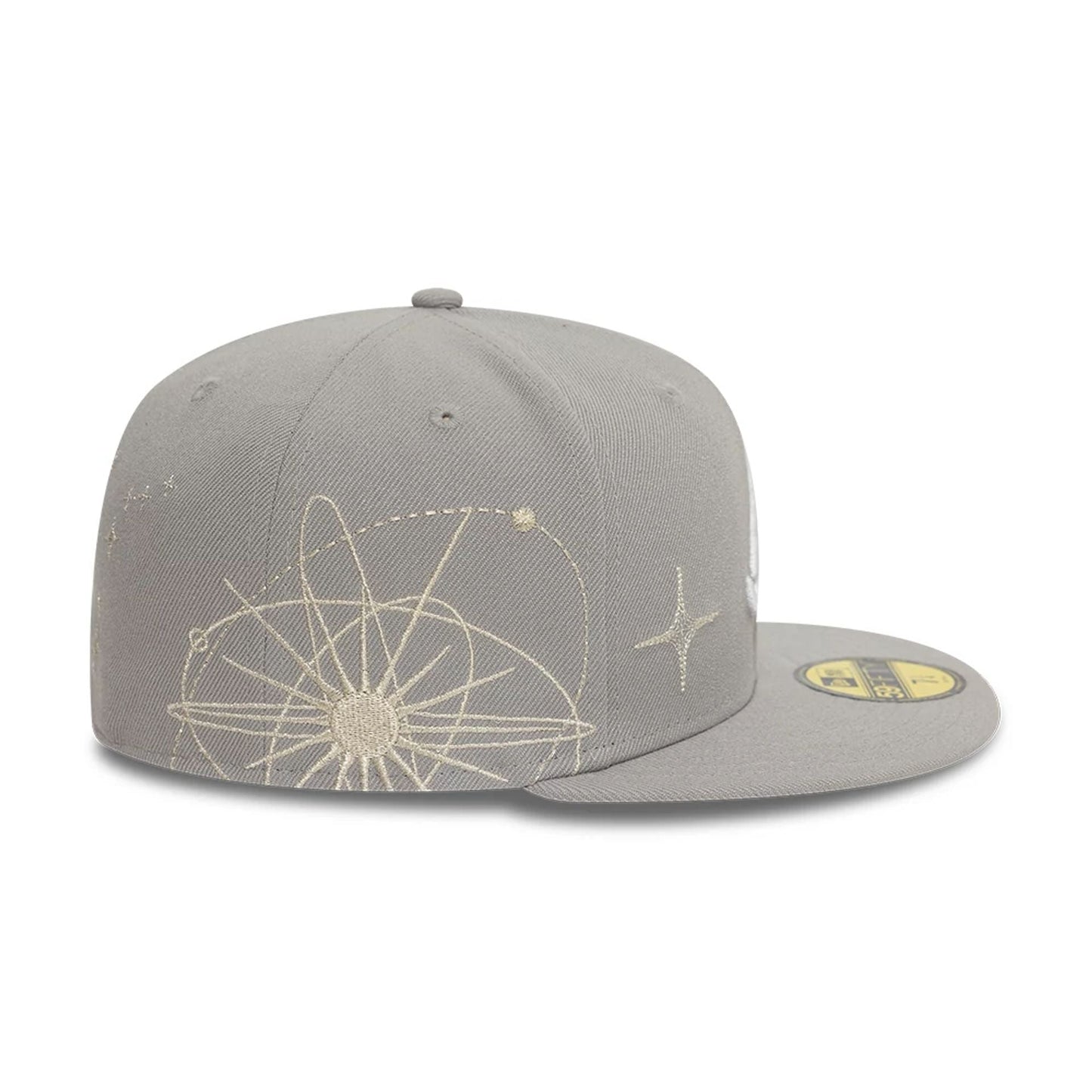 Atlanta Braves MLB Zodiac Grey New Era 59FIFTY Fitted Cap, side view showing intricate beige zodiac design embroidered across the structured grey crown, with a gold 59FIFTY size sticker on the flat visor.