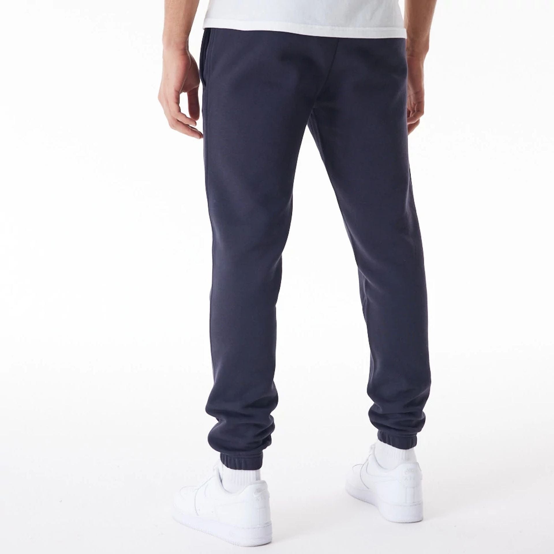 The Male model is wearing New York Yankees MLB Gradient Graphic Navy Joggers 2