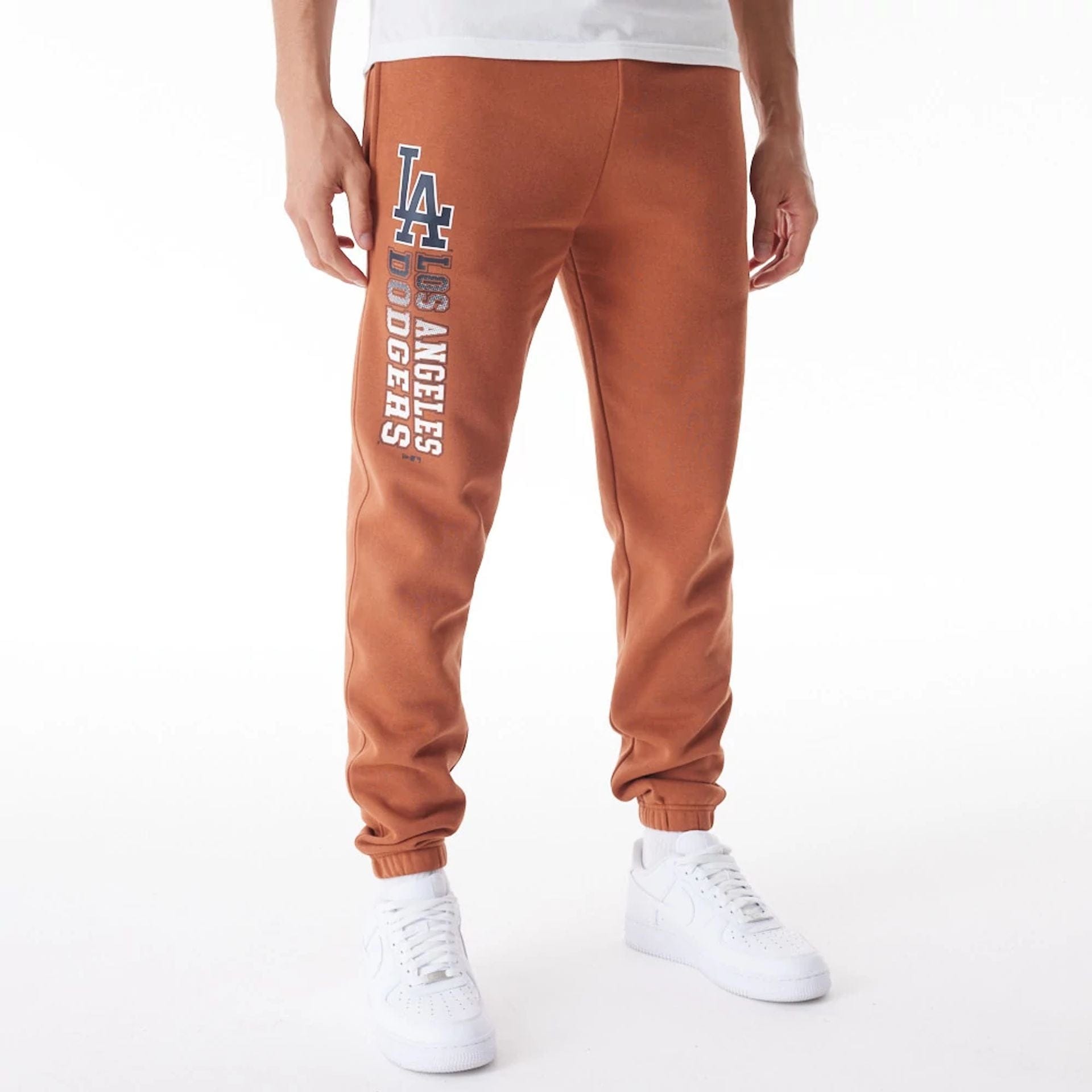 The Male model is wearing LA Dodgers MLB Gradient Graphic Brown Joggers 1