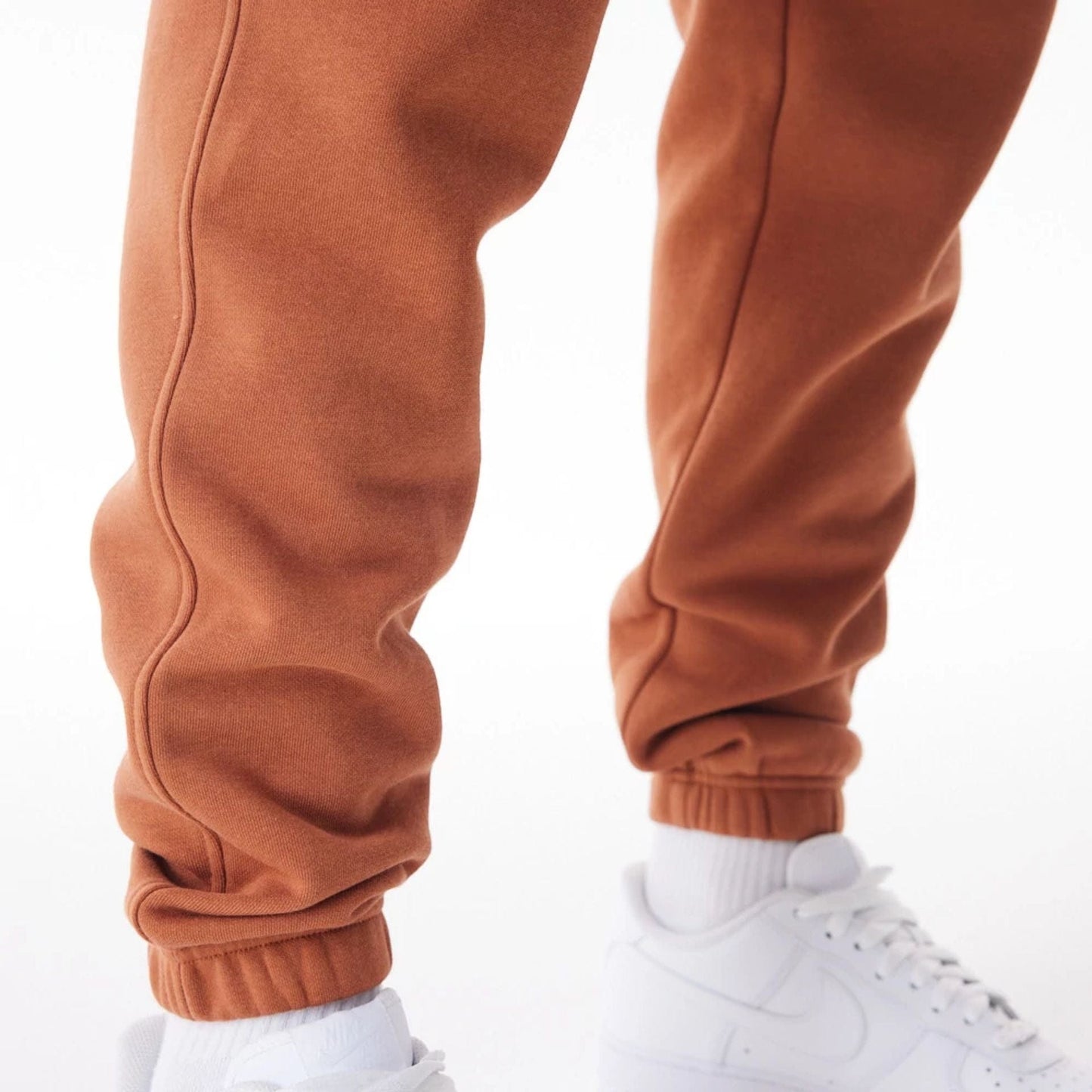 The Male model is wearing LA Dodgers MLB Gradient Graphic Brown Joggers 10