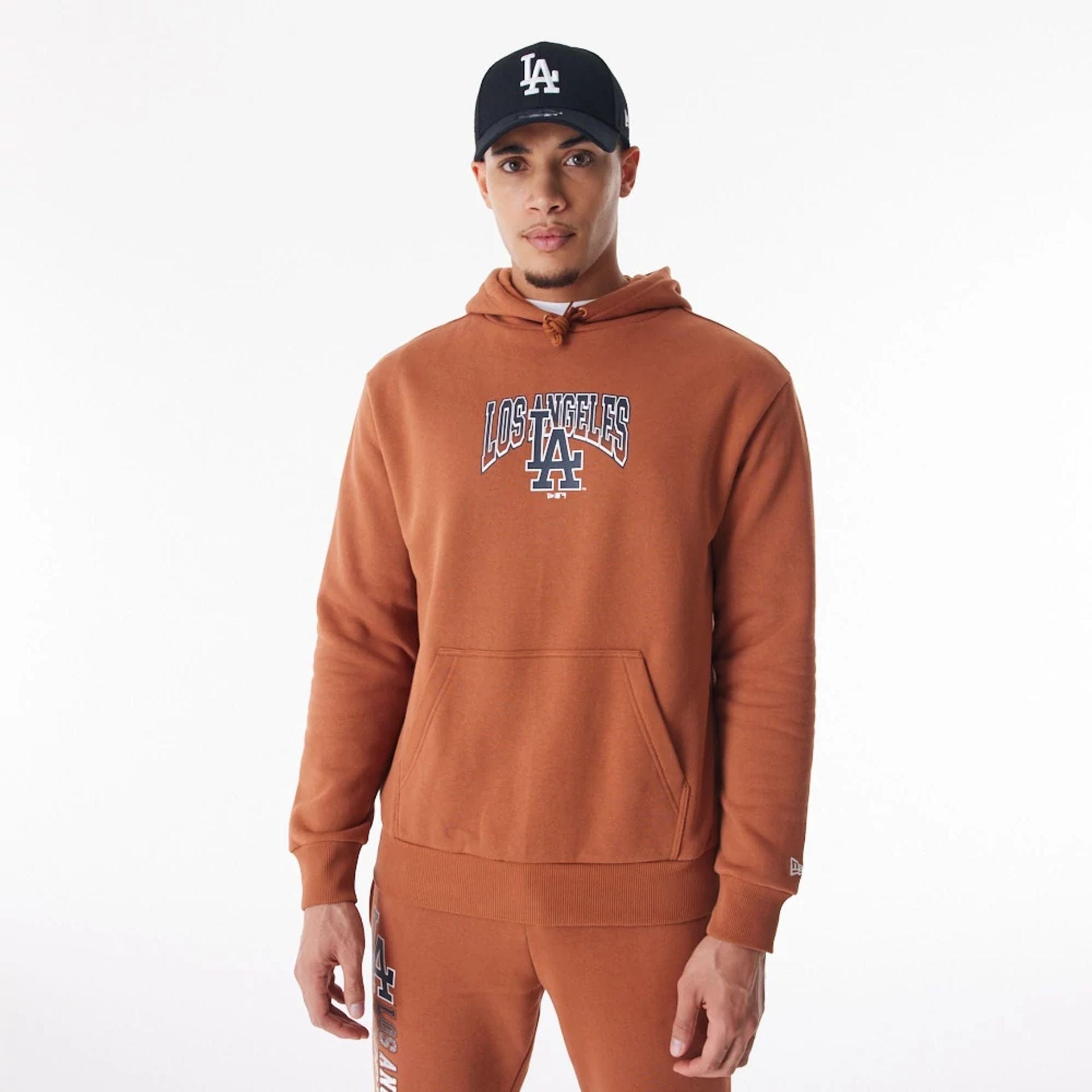 The Male model is wearing LA Dodgers MLB Gradient Brown Oversized Pullover Hoodie 1