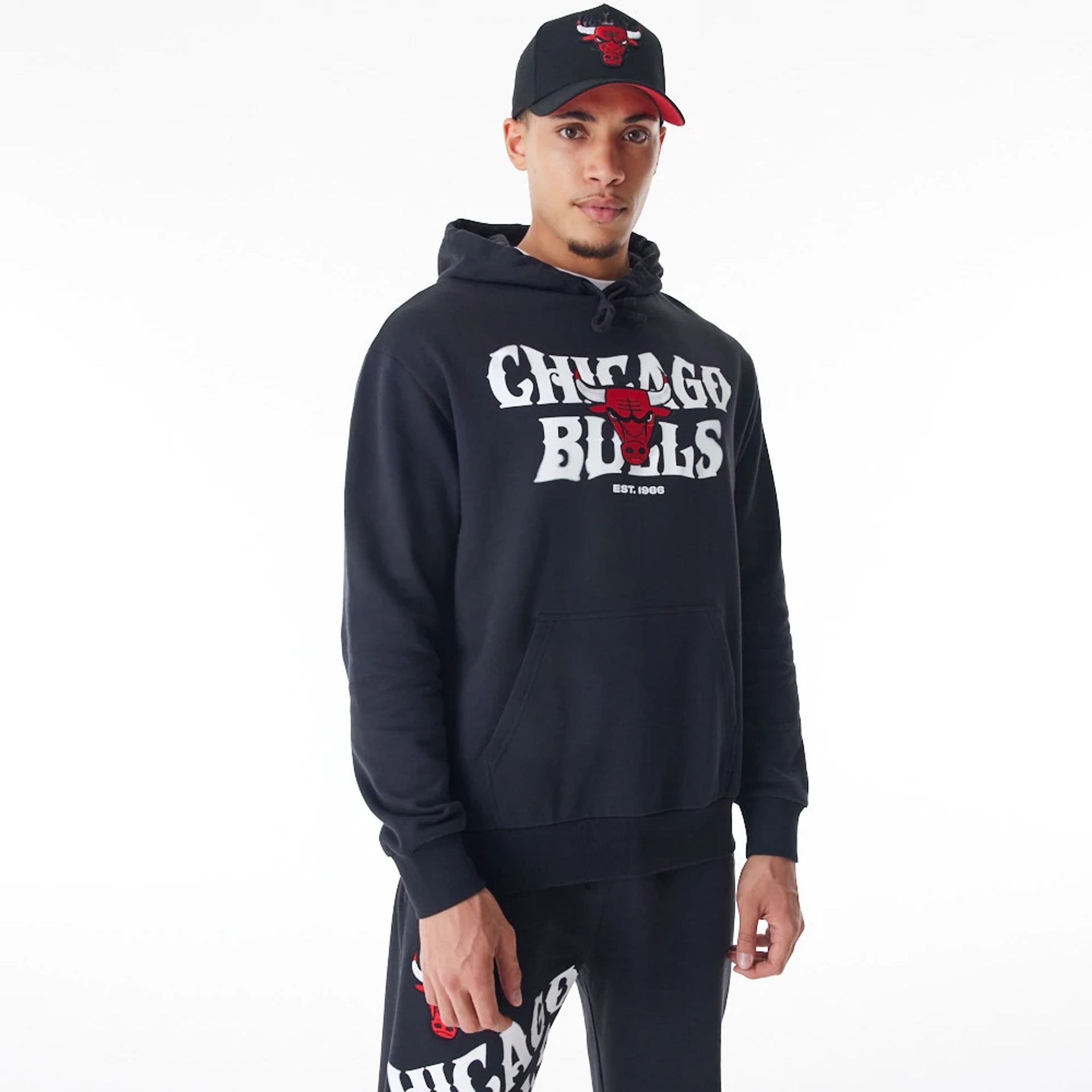 The Male model is wearing Chicago Bulls NBA Graphic Black Oversized Pullover Hoodie 2
