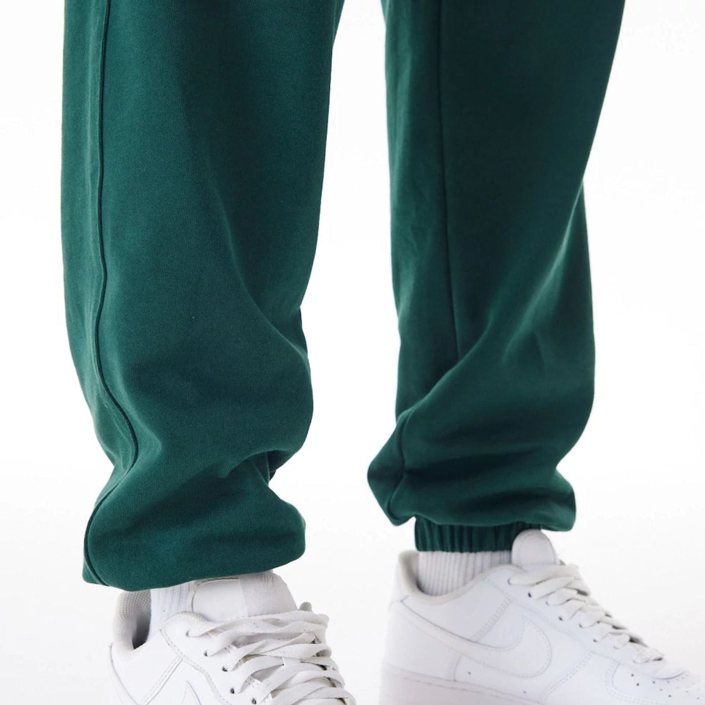 The Male model is wearing Boston Celtics NBA Graphic Dark Green Joggers 8