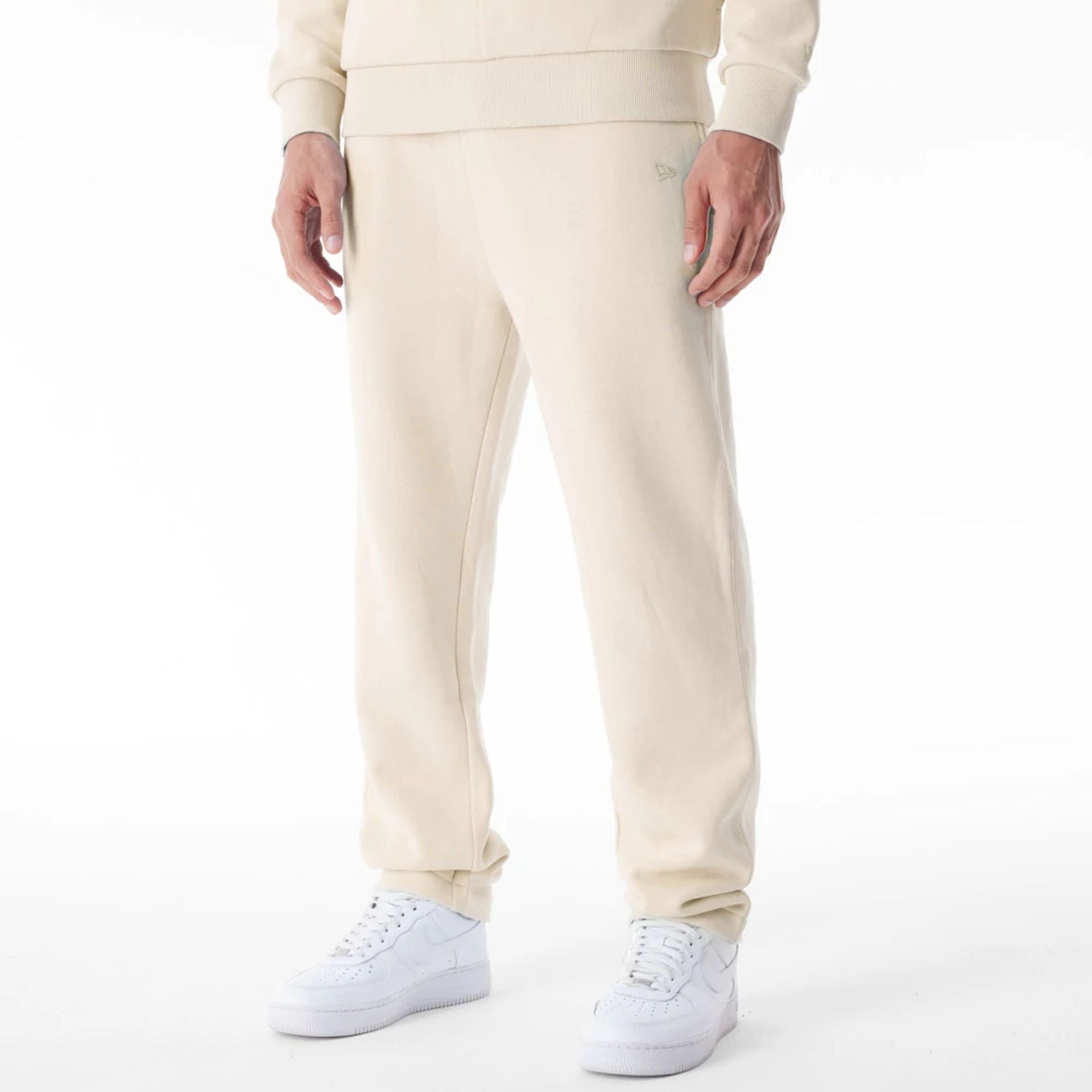 The Male model is wearing New Era Cream Straight Leg Joggers 1