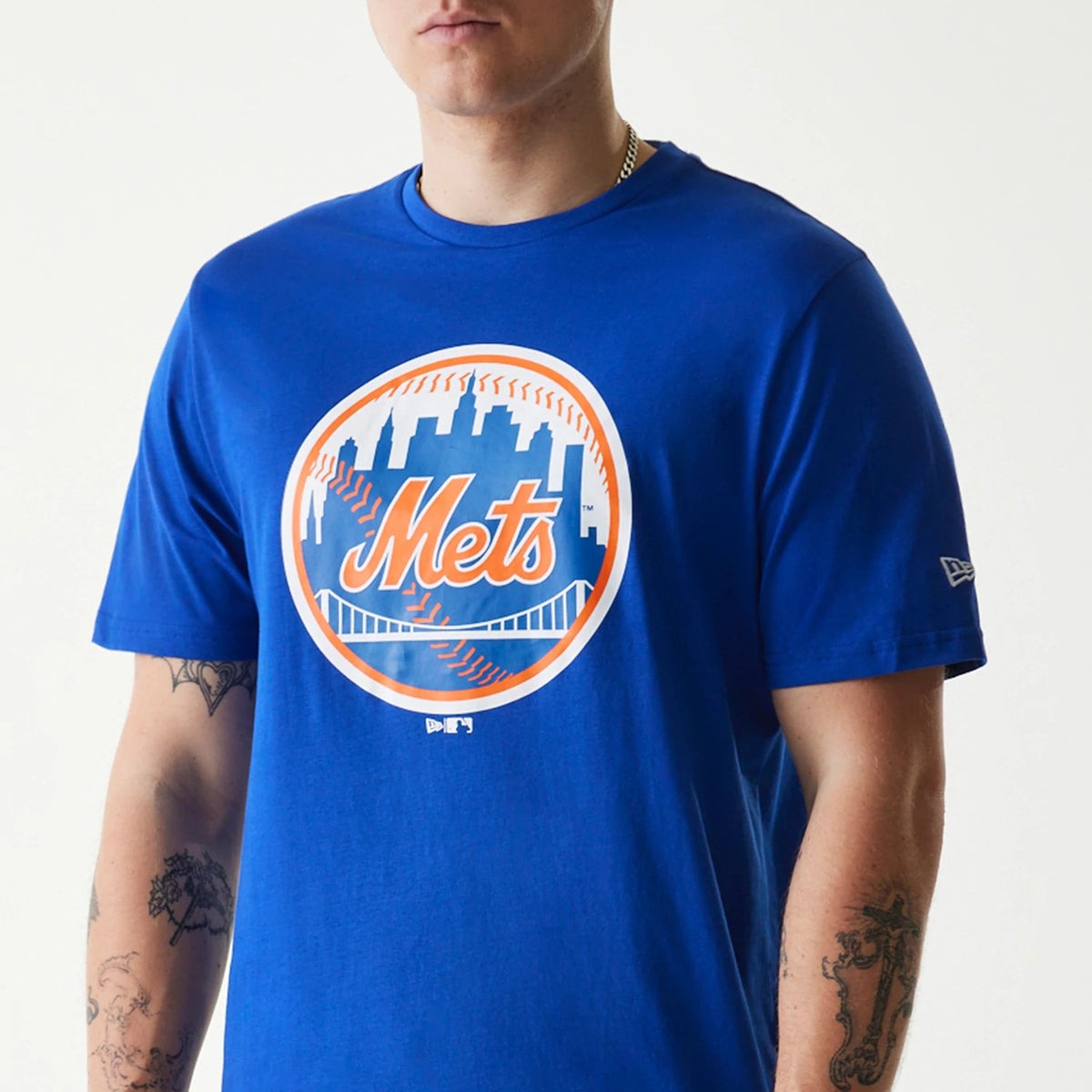 New Era New York Mets MLB Regular Blue T-Shirt, front view showing the large circular Mets logo in orange and white on the centre chest, with a raised New Era logo on the left sleeve.