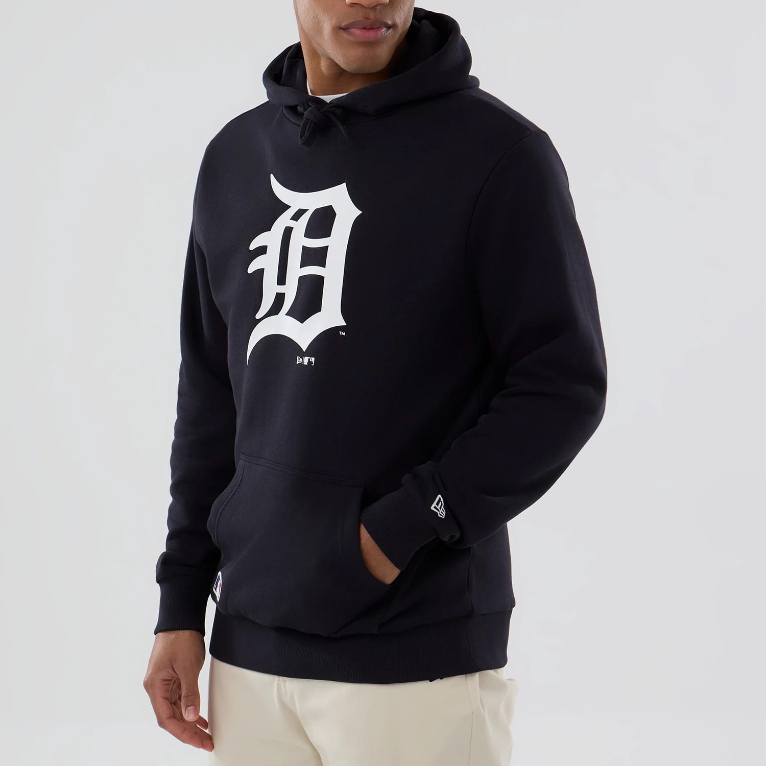 New Era Detroit Tigers MLB Navy Pullover Hoodie, front view showing a large white D logo printed at the centre of the chest, drawstring hood, single front pocket, and a raised New Era logo on the left sleeve cuff.