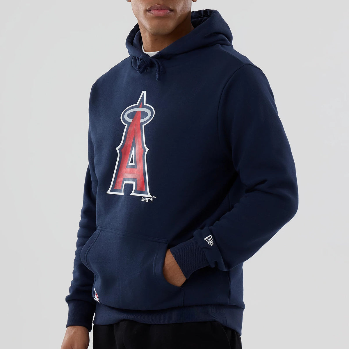 New Era LA Angels MLB Dark Blue Pullover Hoodie, front view showing a large red and white A logo with a halo on the chest, a raised New Era logo on the left cuff, and the hood lying flat at the back.