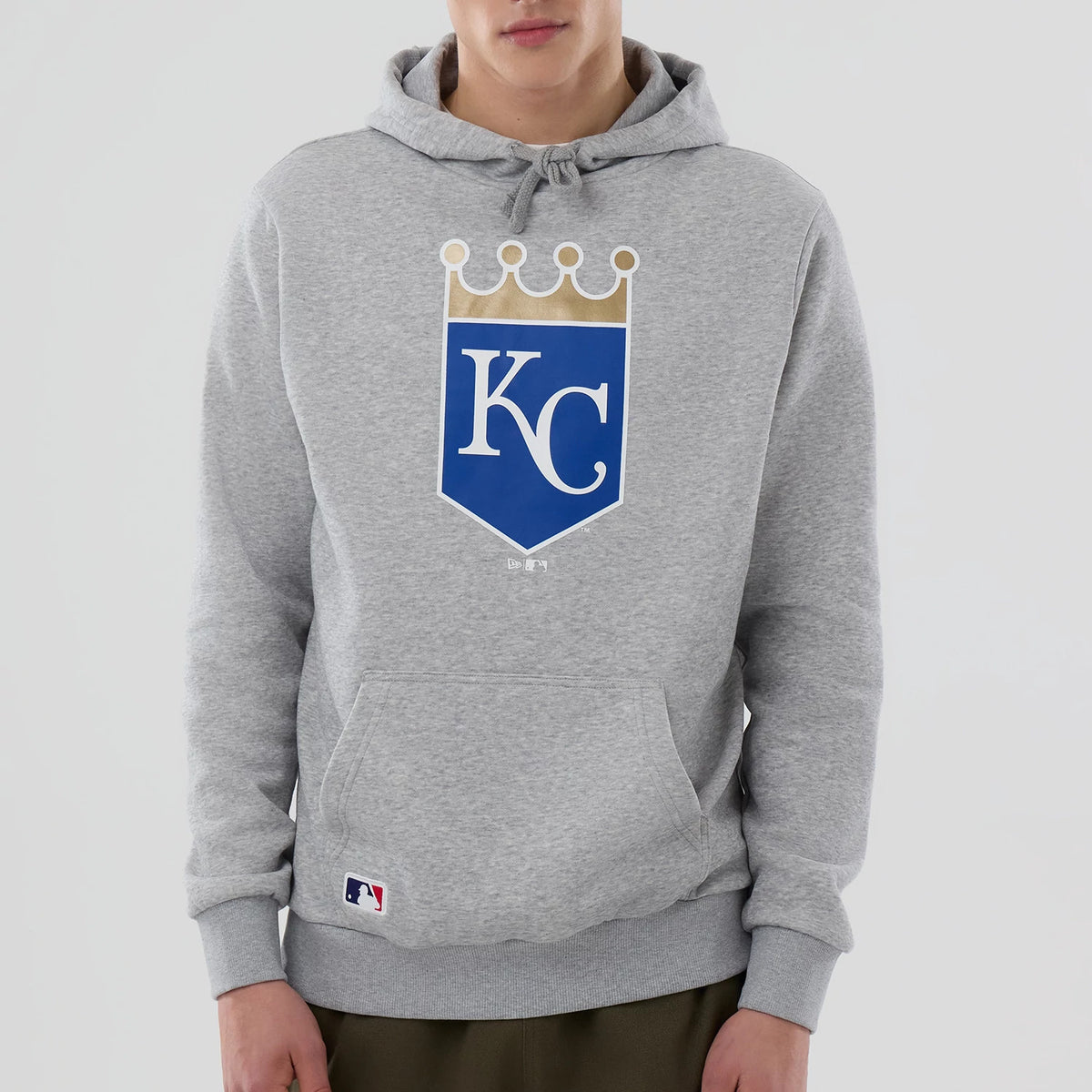 New Era Kansas City Royals MLB Grey Pullover Hoodie, front view showing the grey fabric with a large blue and white KC Royals logo on the chest, a drawstring hood, and a front pocket, with a small New Era logo embroidered near the pocket hem.
