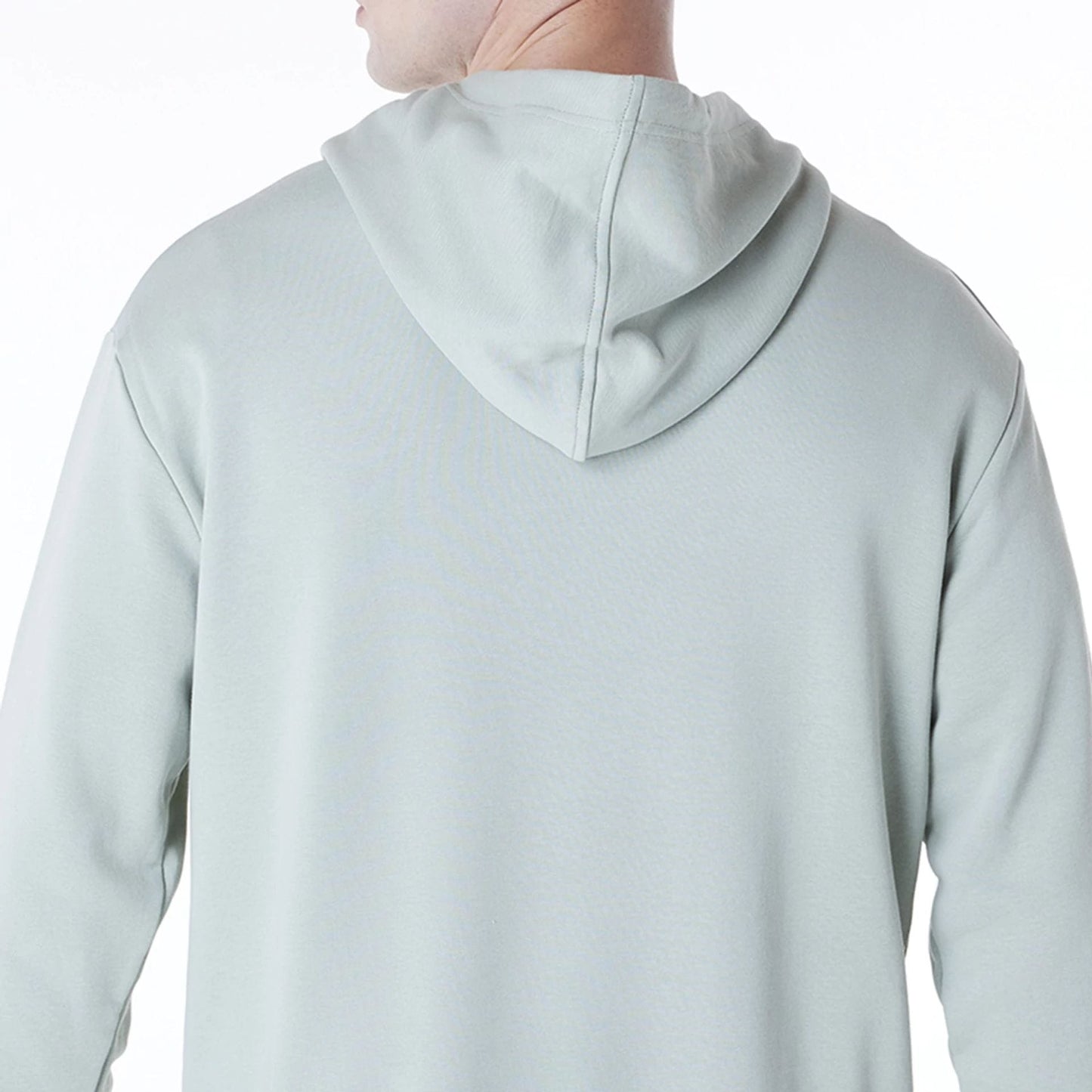 The Male model is wearing New York Yankees MLB League Essential Pastel Green Oversized Pullover Hoodie 7