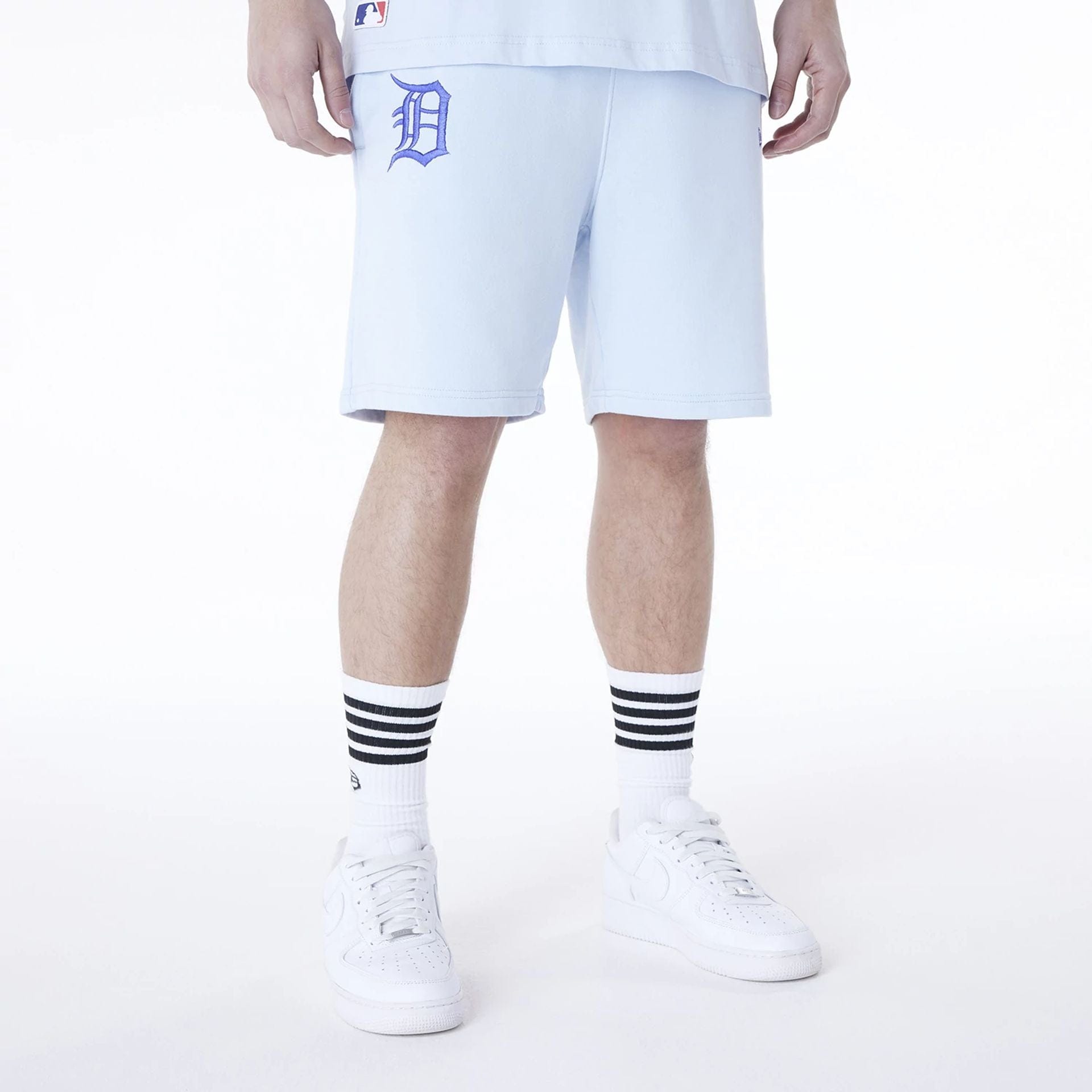 The Male model is wearing Detroit Tigers MLB League Essential Pastel Blue Shorts 1