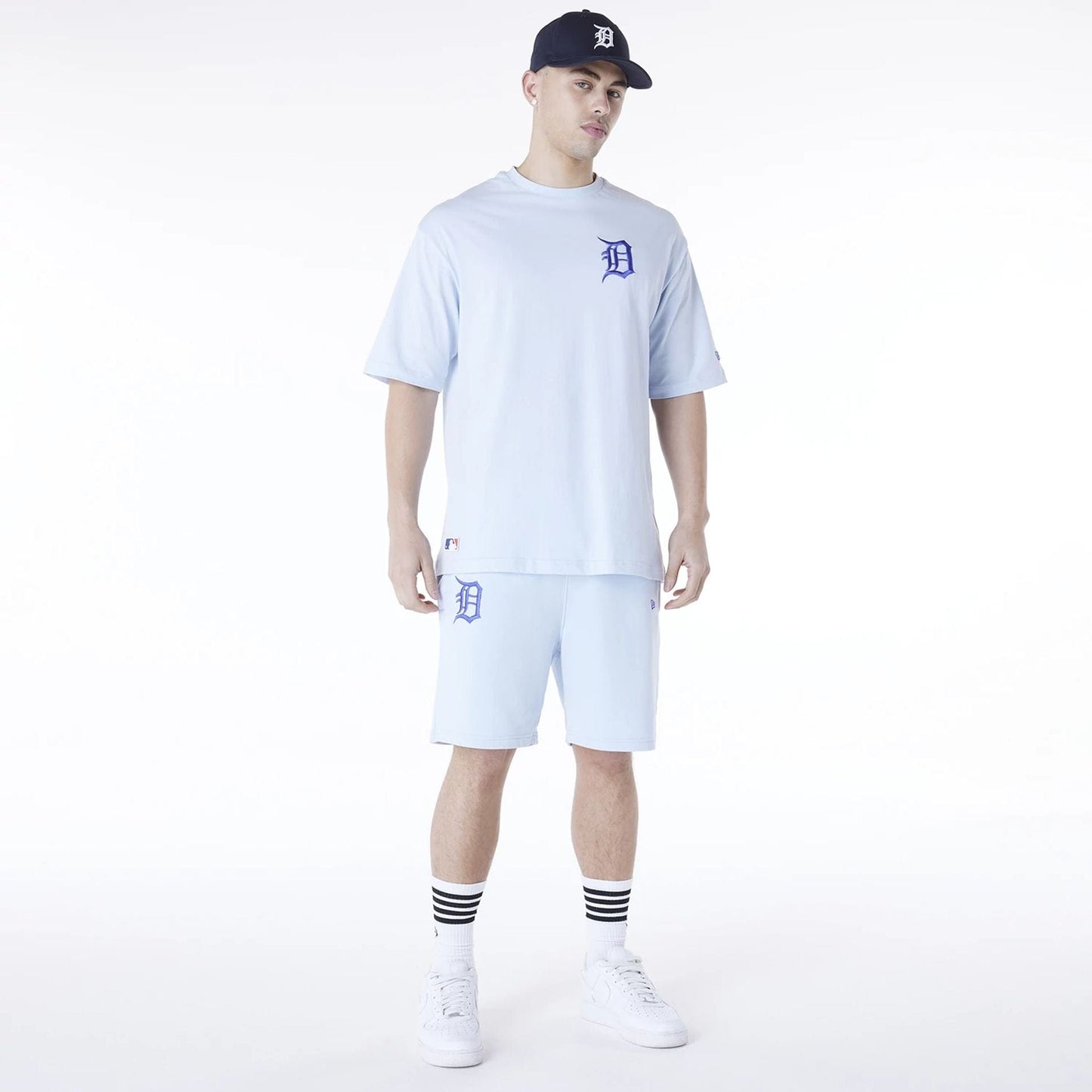 The Male model is wearing Detroit Tigers MLB League Essential Pastel Blue Shorts 7