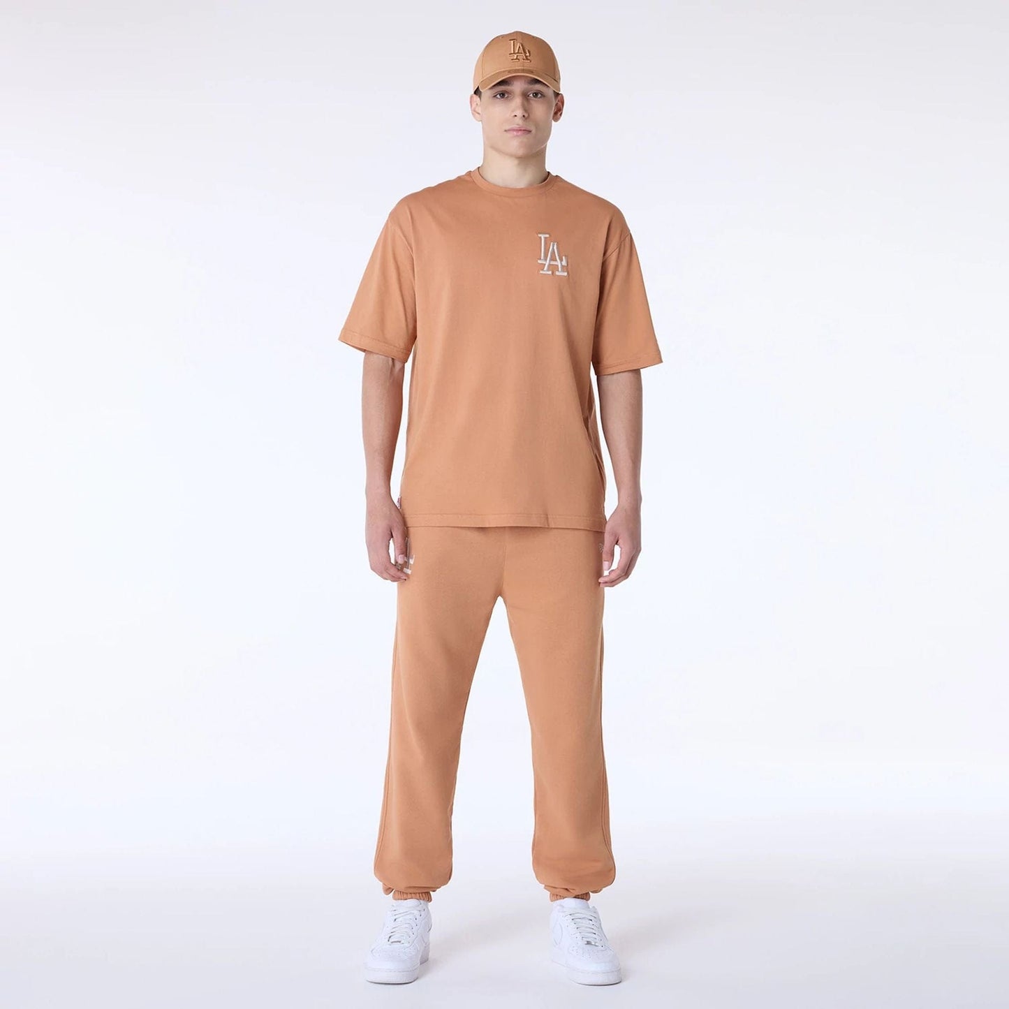 The Male model is wearing LA Dodgers MLB League Essential Dark Beige Oversized T-Shirt 8